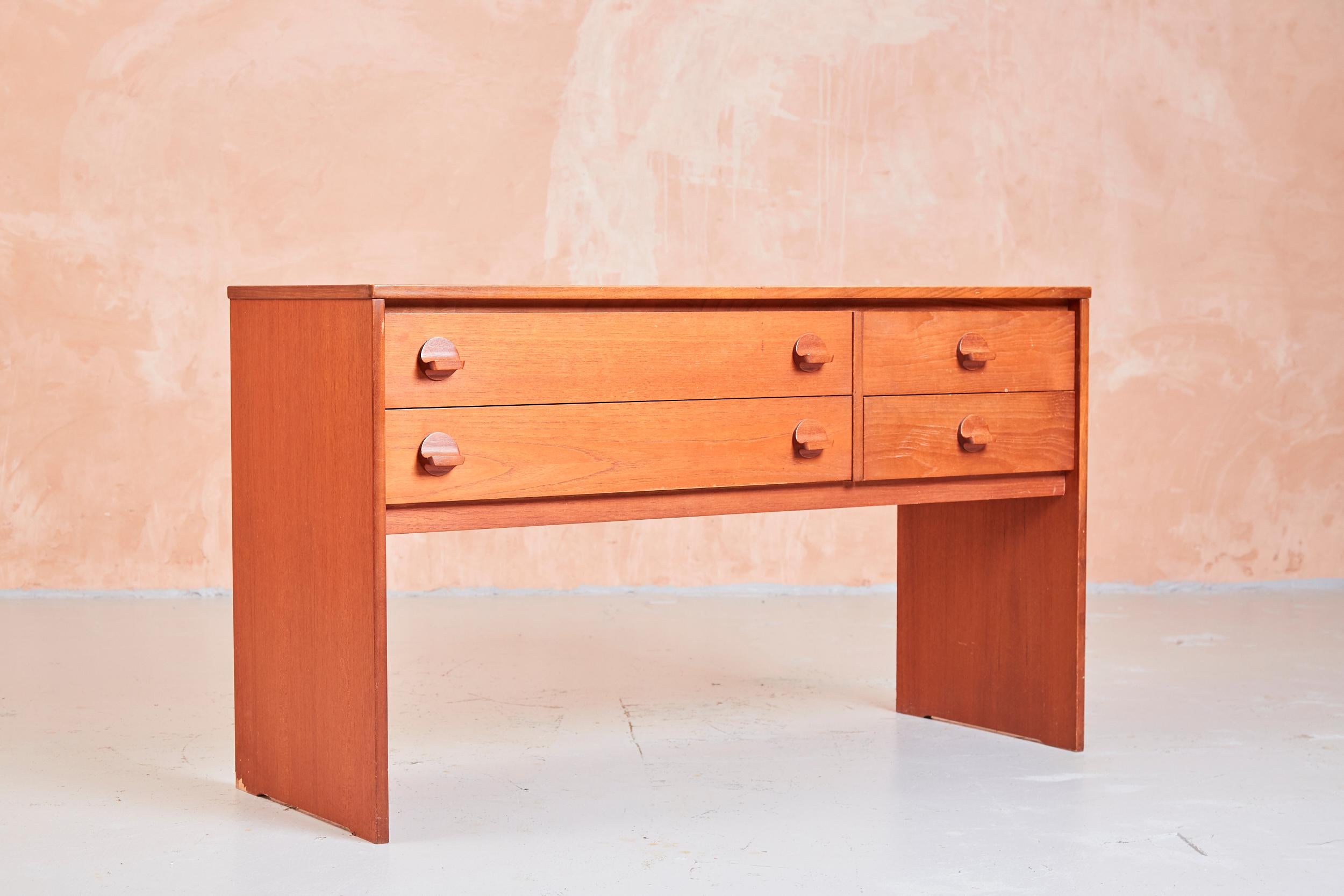 Mid century teak Stag console or dressing table with wooden handles

This is an excellent piece of furniture from the well known and respected manufacturer Stag.

As with all furniture produced by Stag this is a well made piece.

Ron Carter, 1926 -
