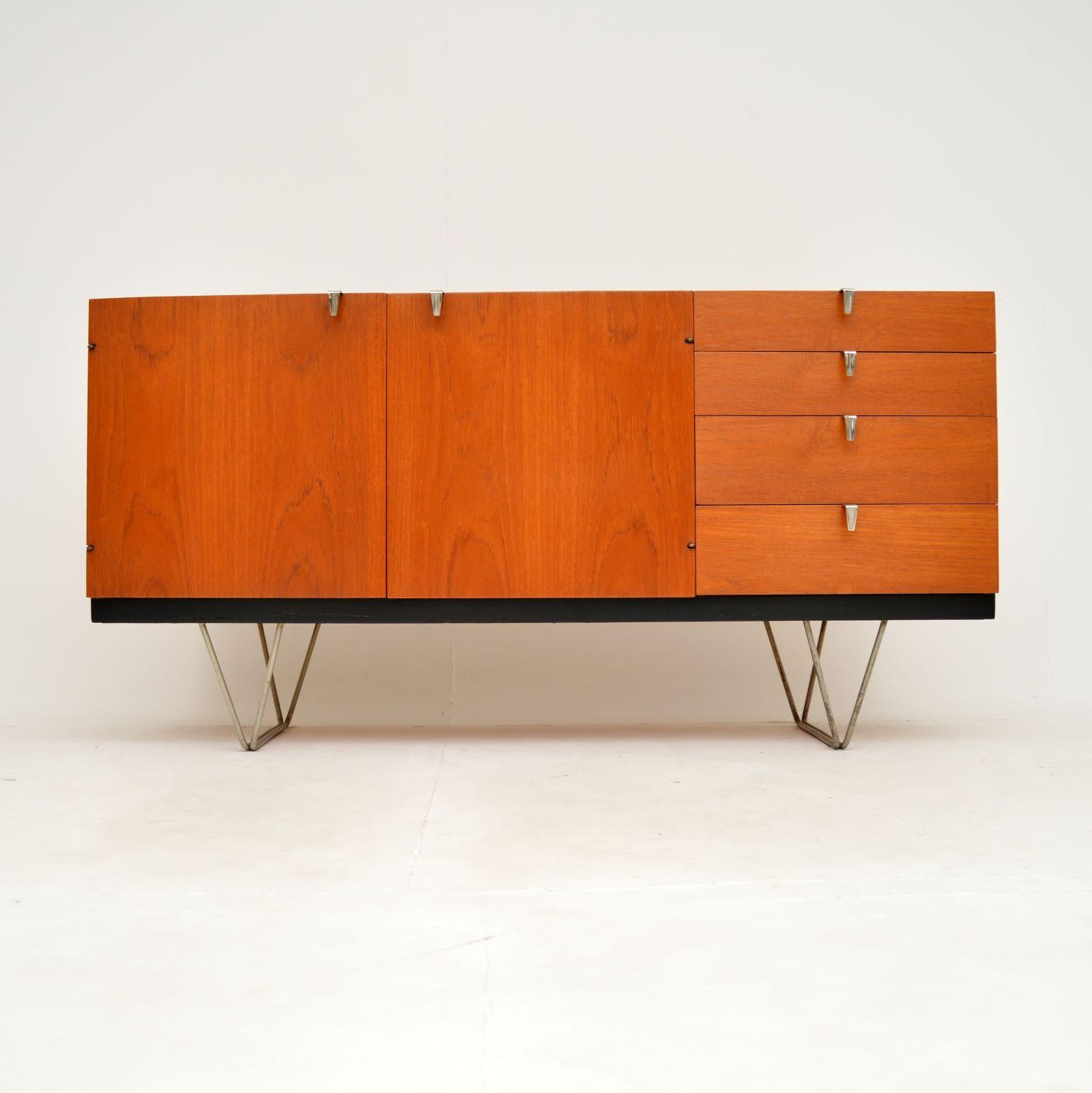A fantastic original vintage S range sideboard in teak, designed by John and Sylvia Reid for Stag. This was made in England in the 1960’s.

An extremely stylish an iconic design, instantly recognisable from its lovely hair pin steel legs. These were