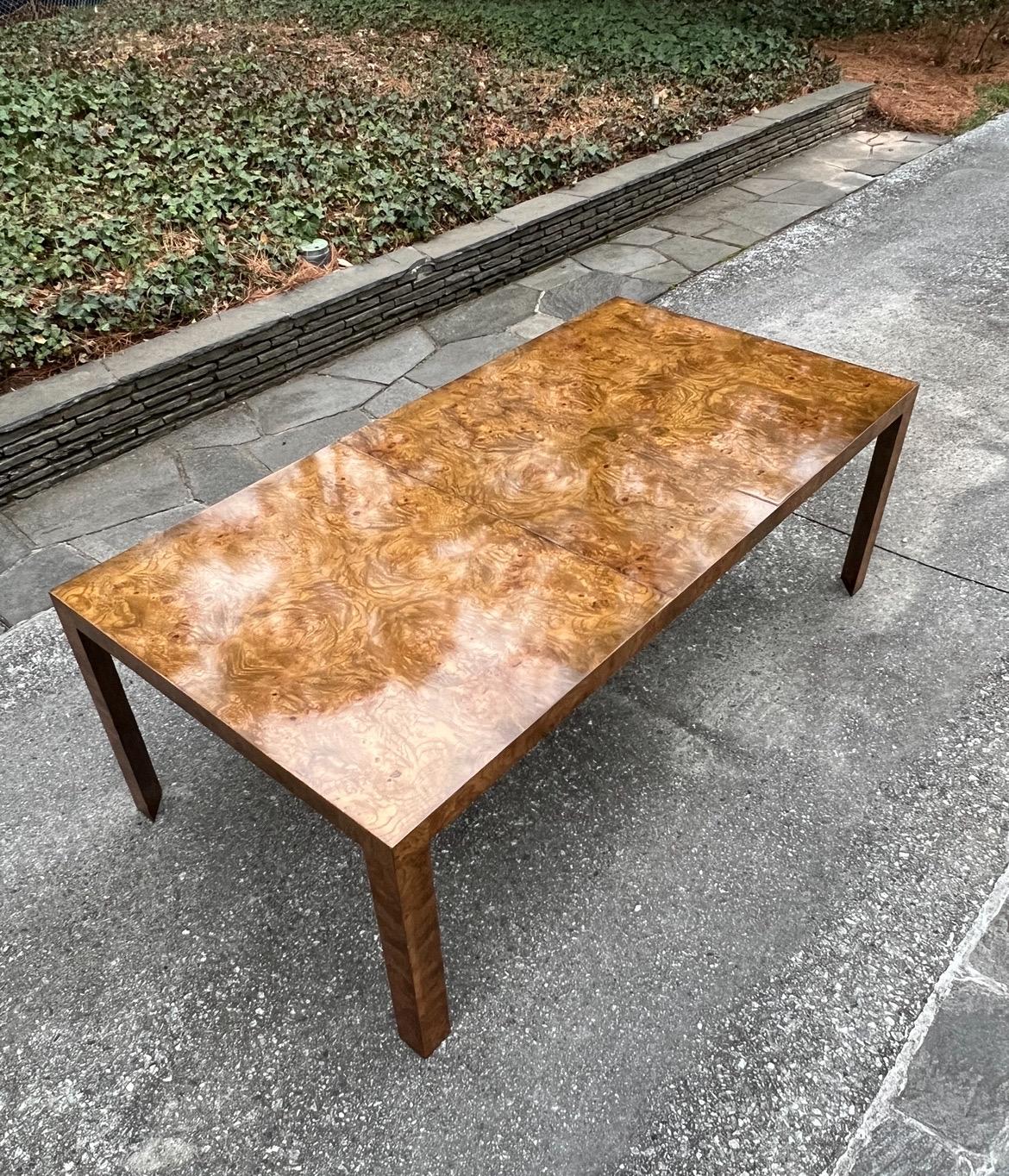 A breathtaking restored heavy-duty Parsons style extension dining table by the esteemed Edward Wormley for Dunbar, circa 1975. Exquisite bookmatched Butterfly patterned elm veneer over solid maple construction. Stout and heavy as lead. Stunning