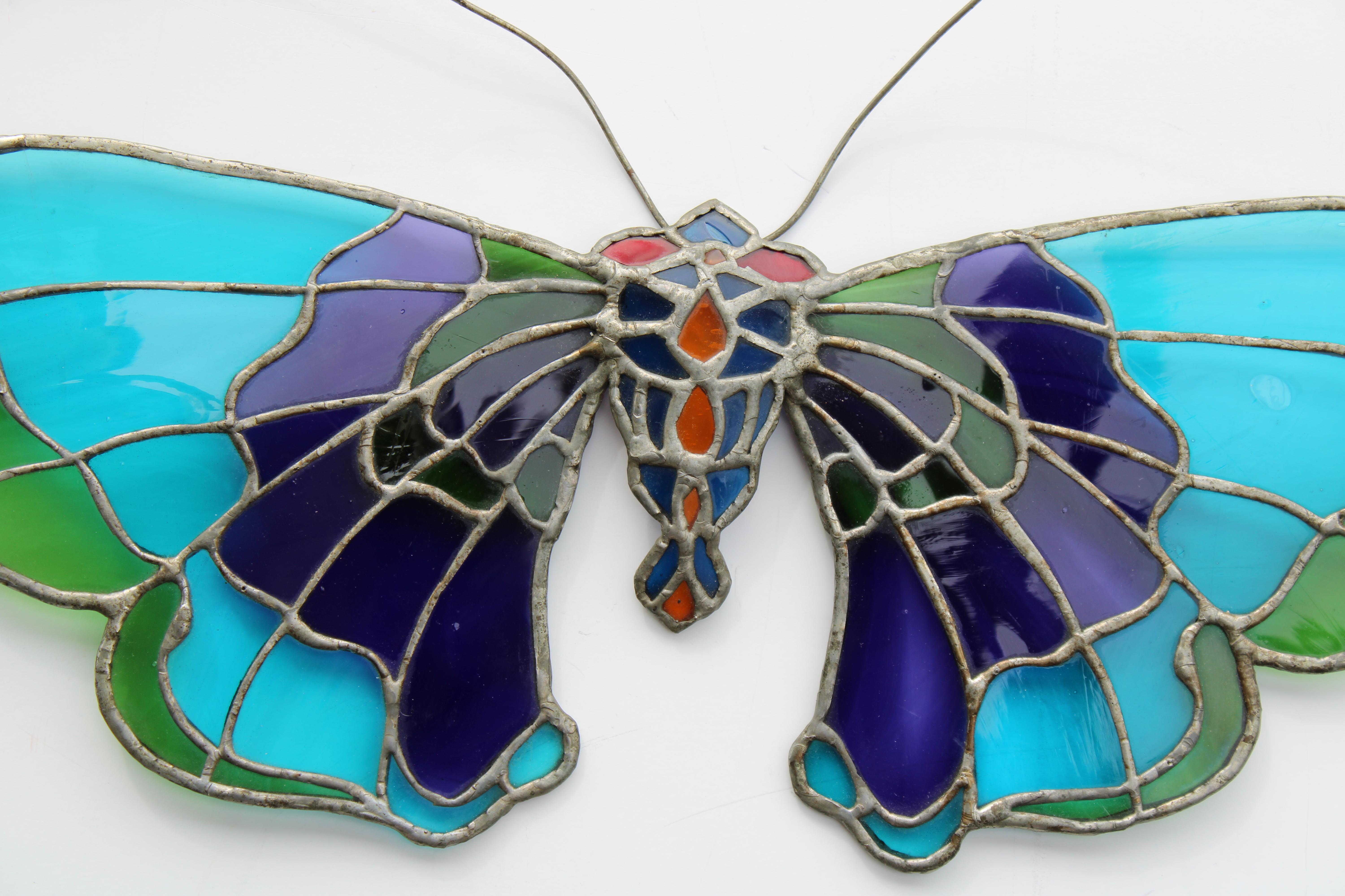 Stain glass butterfly by a New York City artist named Gilly.  I knew Gilly back in the 1970s and opened a store very briefly in the village called Gilly Glass. 
 Butterfly measures 23.5