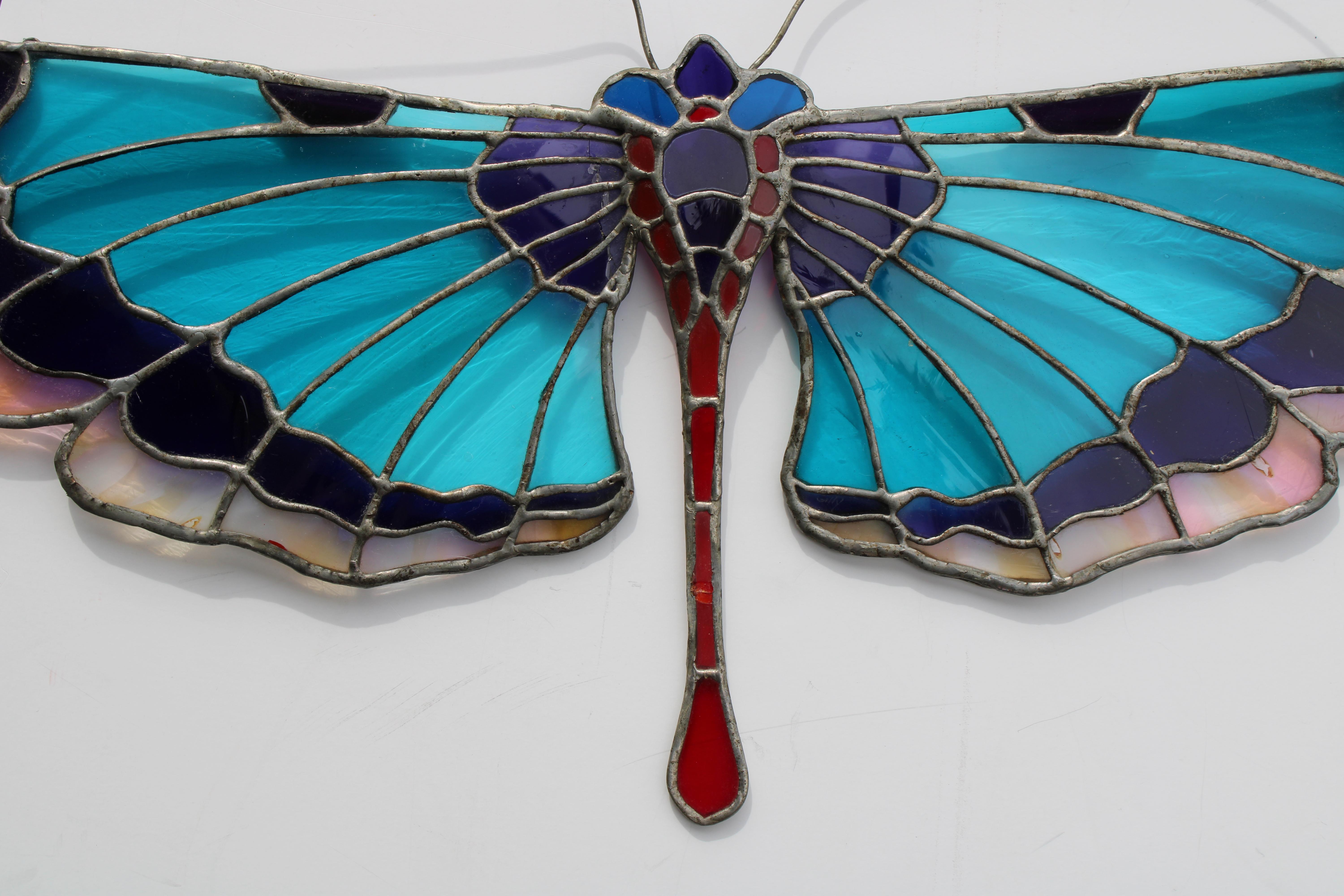 Stain glass dragon fly by a New York City artist named Gilly.  I knew Gilly back in the 1970s and he opened a store very briefly in the village called Gilly Glass.   Butterfly measures 28.5