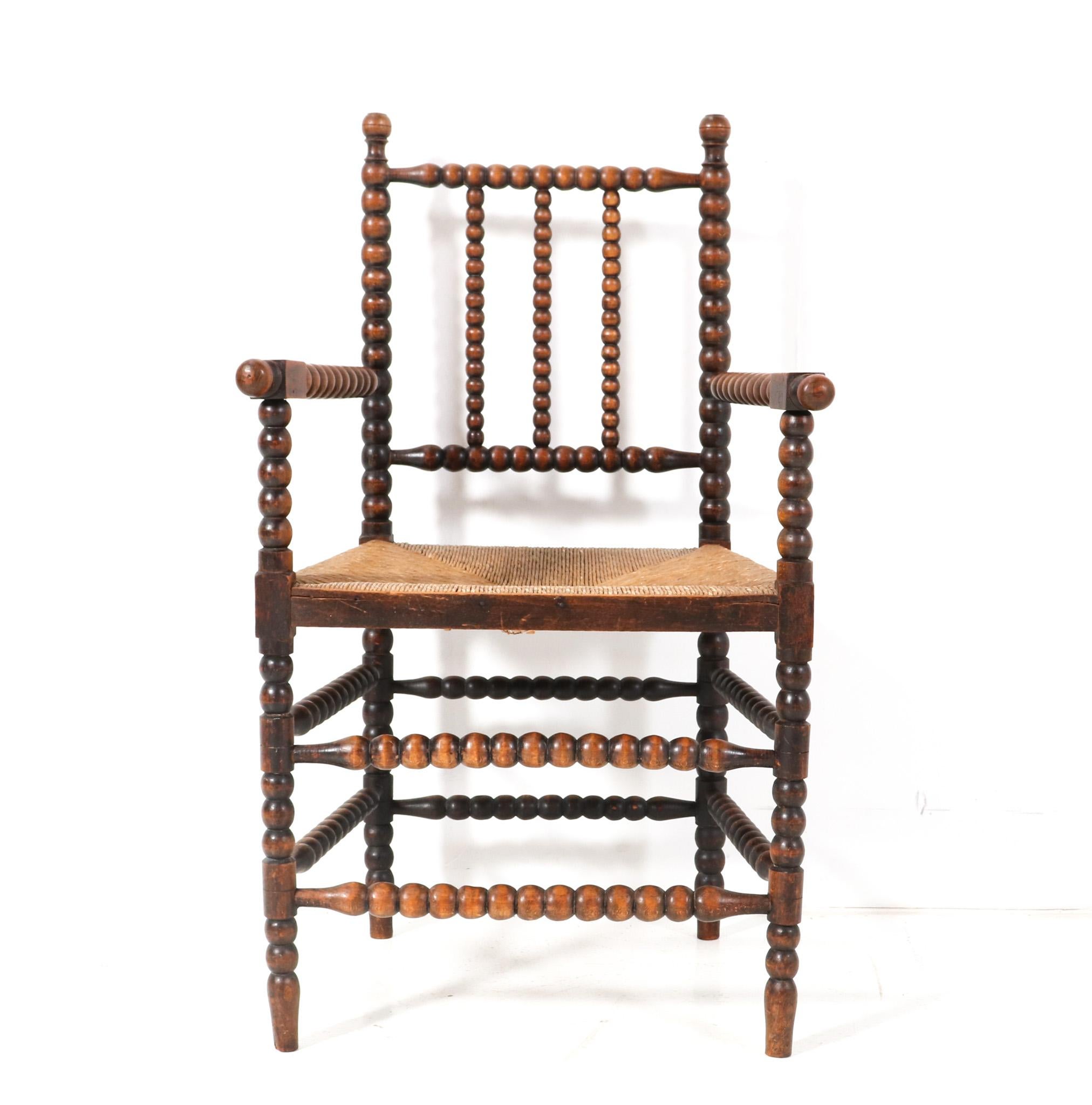 Stunning and rare Jacobean style bobbin armchair.
Striking Dutch design from the 1900s.
Solid handcrafted beech frame with bobbin turned back, legs and supports.
Original woven rush seat.
This wonderful Jacobean style bobbin armchair is in good