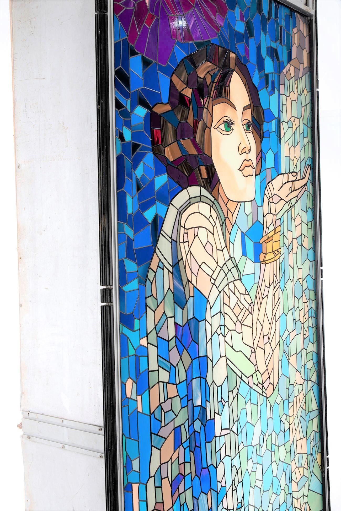 Stained glass designer lightbox featuring a gorgeous image of a woman blowing a kiss. Floorstanding and completely captivating, a one-off piece perfect for an interior design project. Please note we have included images of the lightbox when switched
