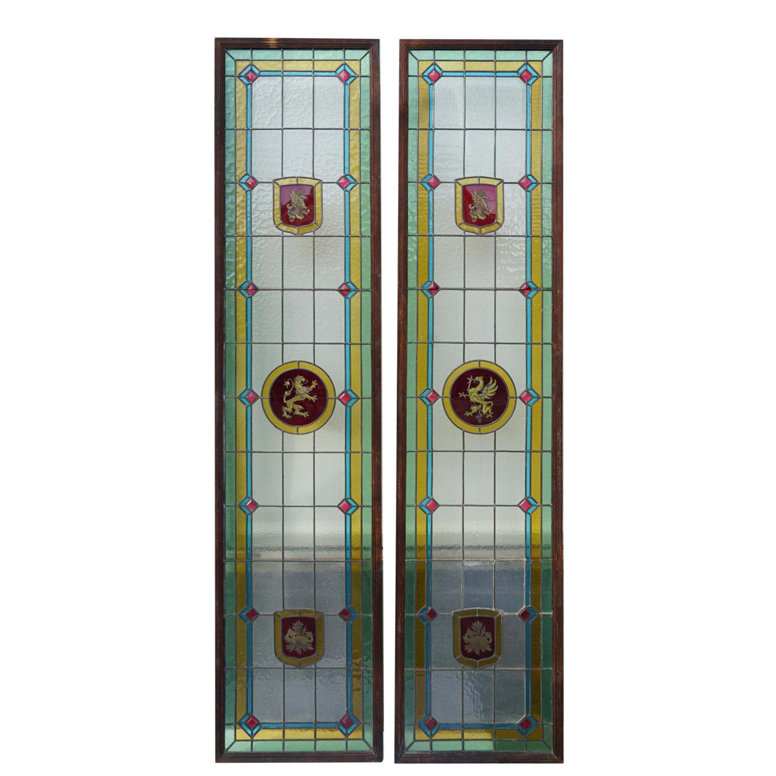A pair of antique stained glass panels. Note the wear and tear.