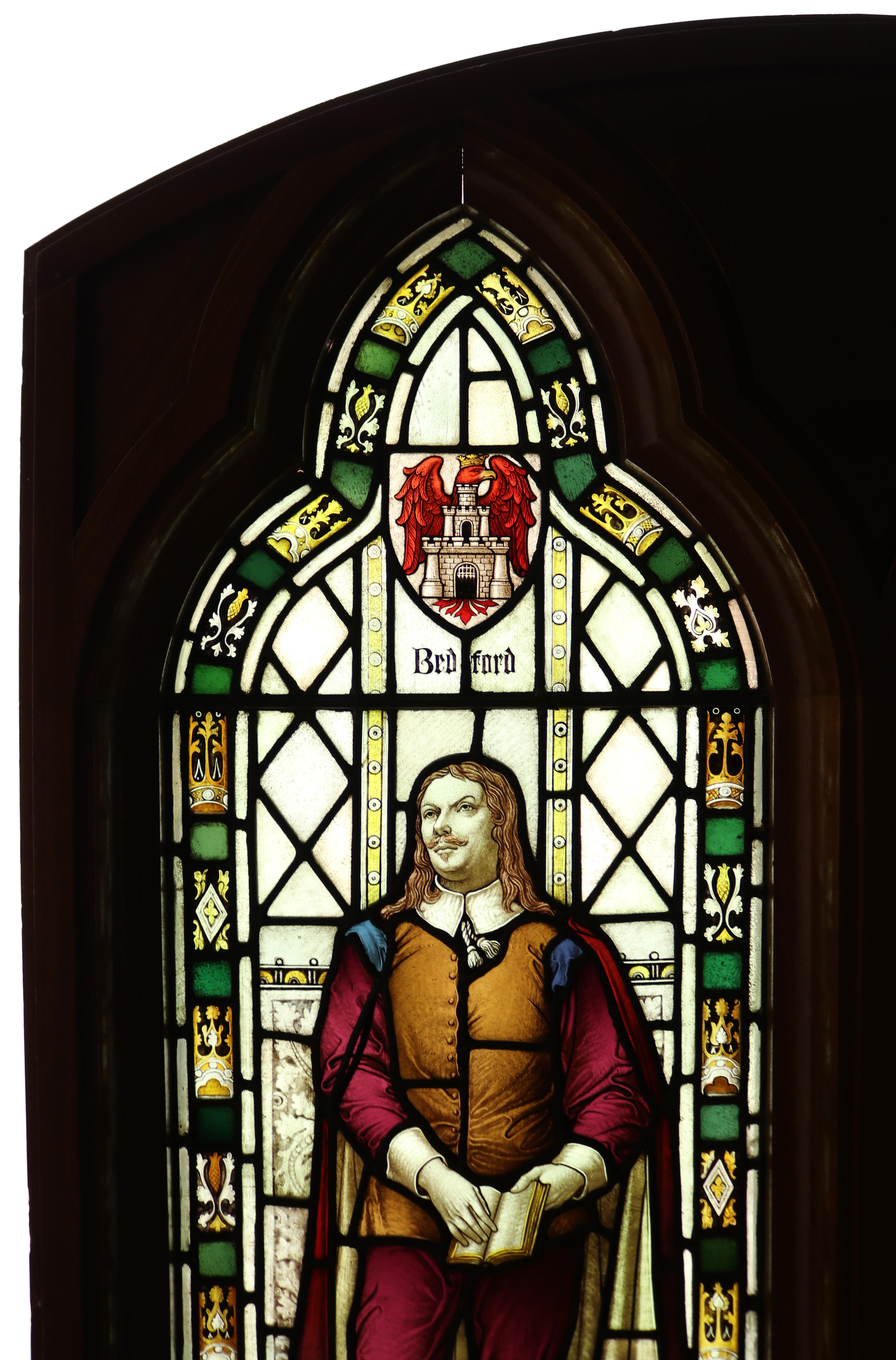 A large stained glass window depicting Oliver Cromwell, an English general and statesman who led the Parliament of England's armies against King Charles I during the English Civil War and ruled the British Isles as Lord Protector from 1653 until his