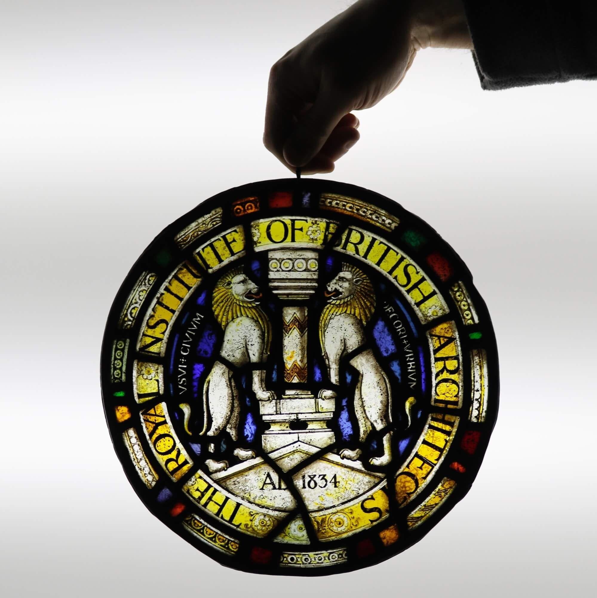 A late 19th century stained glass roundel detailed with the crest of The Royal Institute of British Architects (RIBA). The Institute was established in 1834 and remains to this day a symbol of excellence and professionalism in architecture. Formerly