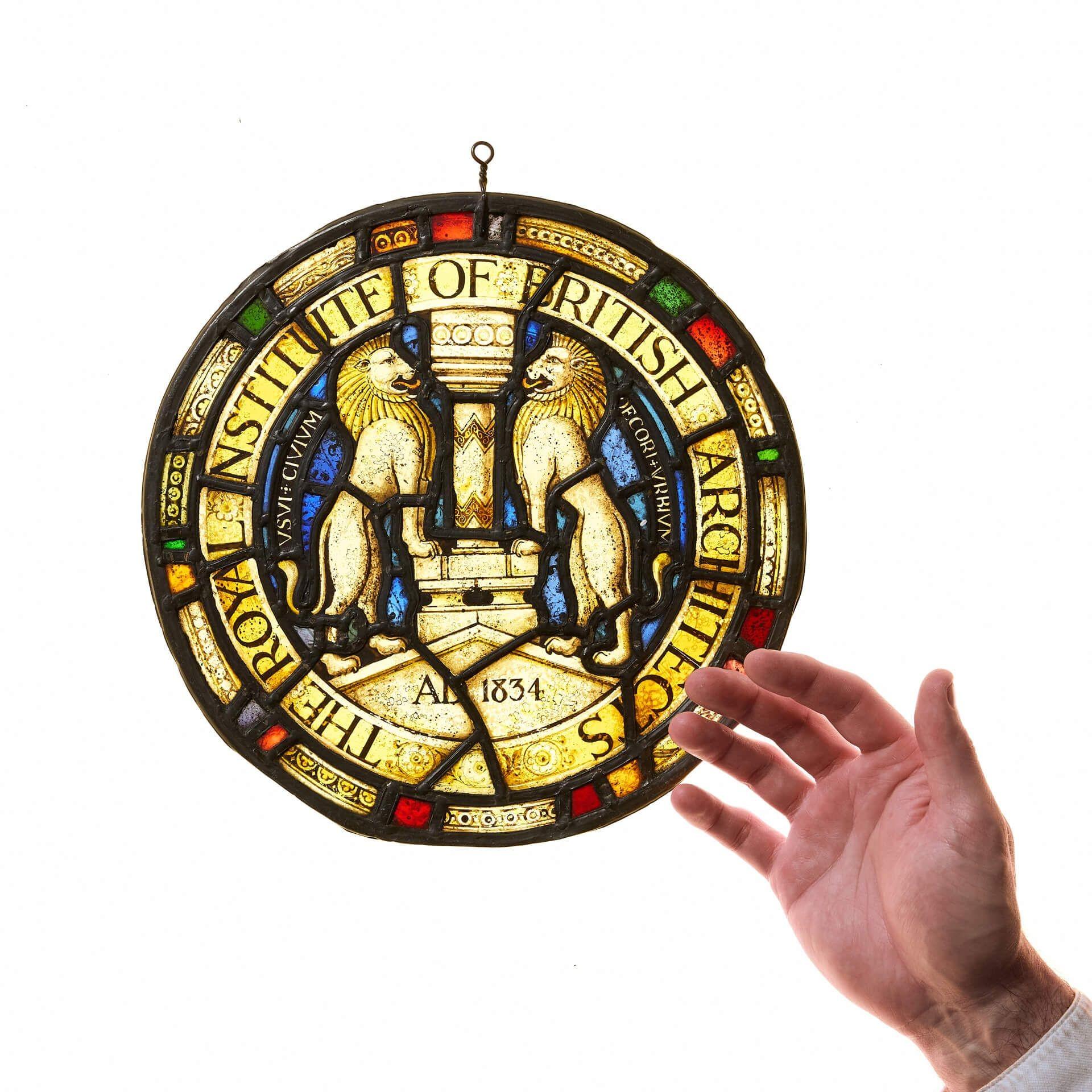 A late 19th century stained glass roundel detailed with the crest of The Royal Institute of British Architects (RIBA). The Institute was established in 1834 and remains to this day a symbol of excellence and professionalism in architecture. Formerly