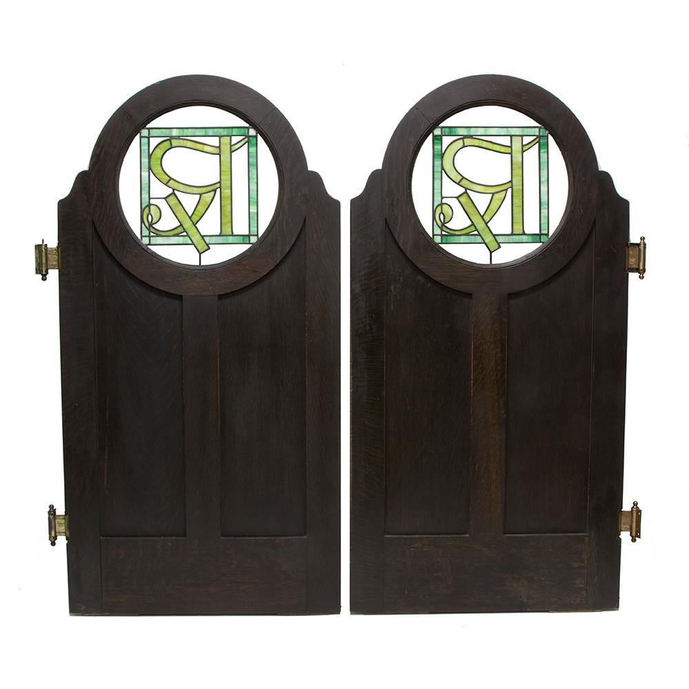 These phenomenal doors have a history in upstate New York. They were once an architectural element in a pharmacy in the town of Chateaugay, NY. The craftsmanship is very clear in the thick quarter sawn oak, which has been treated with a dark stain.