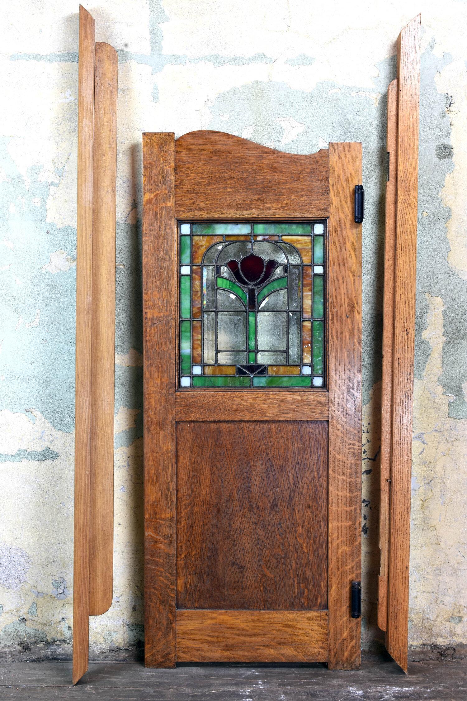 So many uses for this stained and bevelled glass tiger cut oak pub door. Entrance to your home bar, pantry or just a divide from one section of your home to another. The side wood pieces are the jamb for the door. It is meant to hang in a space with