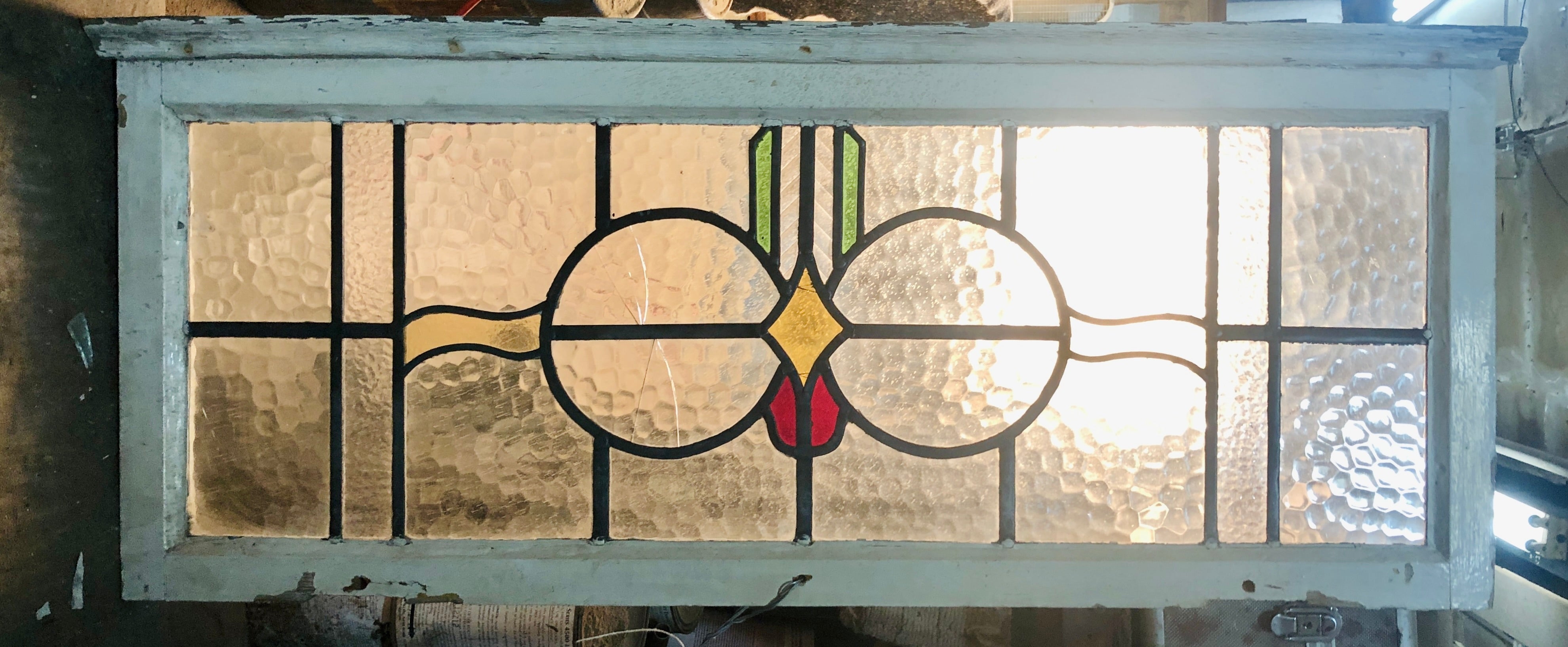 Art Deco style window with stained glass patterns.The clear glass is textured to let ample sunlight in and also provide privacy.
Currently housed in a wooden frame - the overall dimensions are for the stained glass and the frame.
Located in NY
