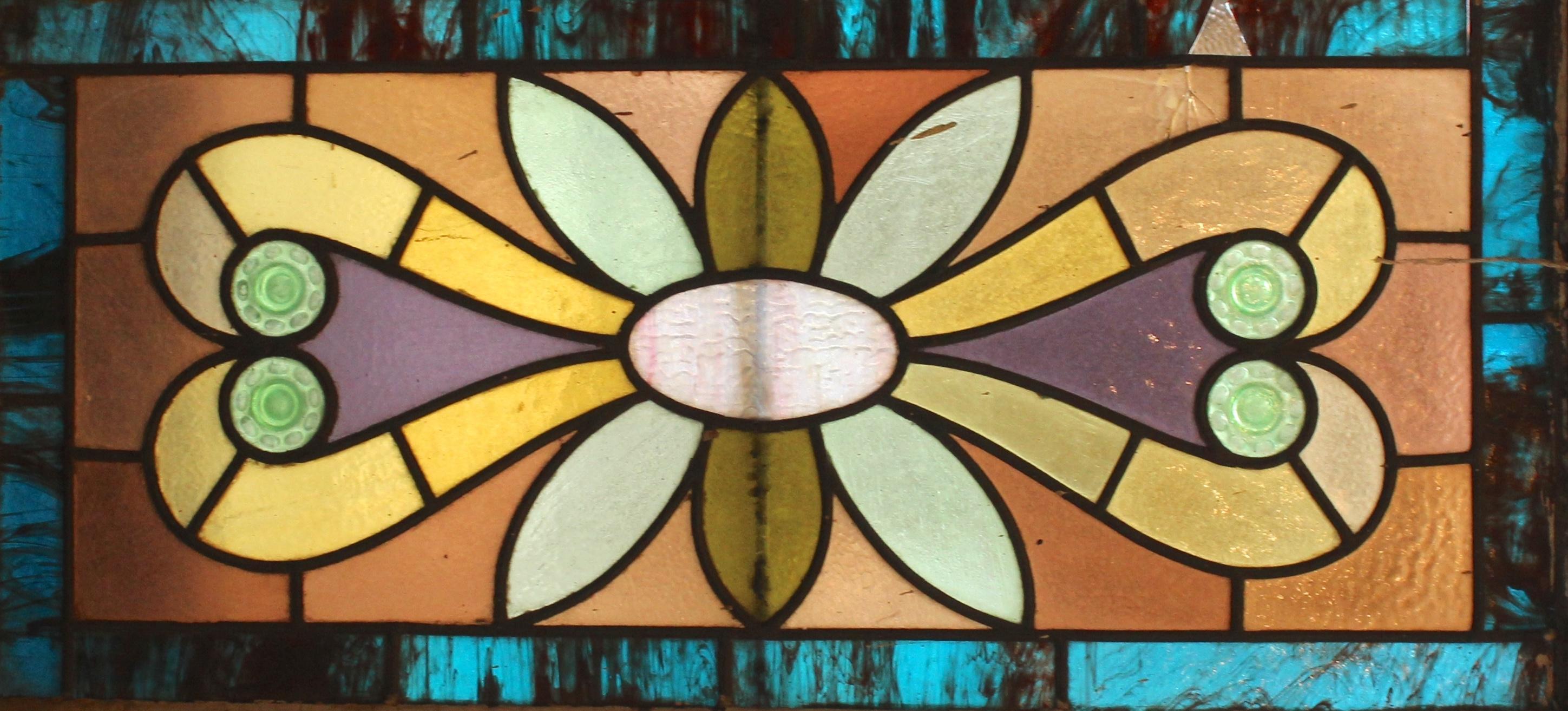 Striking colored glass window with leaded designs. Textured and marbled colored stained glass.
Currently housed in a wooden frame - the overall dimensions are for the stained glass and the frame.
Located in NY