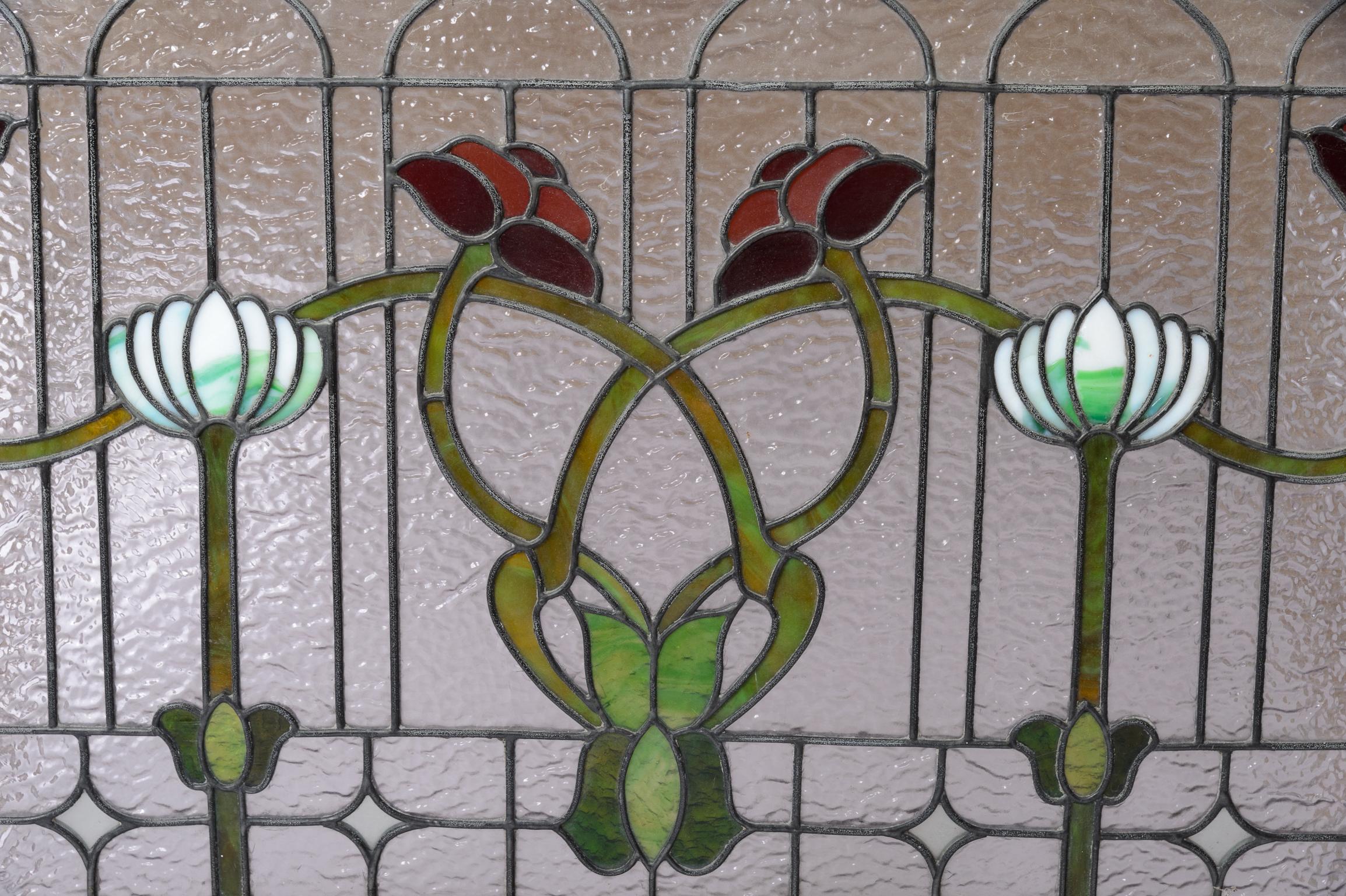 Vintage 1920-30s Stained Glass Window
Whiplash Art Nouveau Design featuring Poppies and Waterlilies 
Clear Ripple Glass Background pushes the design forward and acts to obscure 
A fine example of a Cincinnati Window
Glass in very good