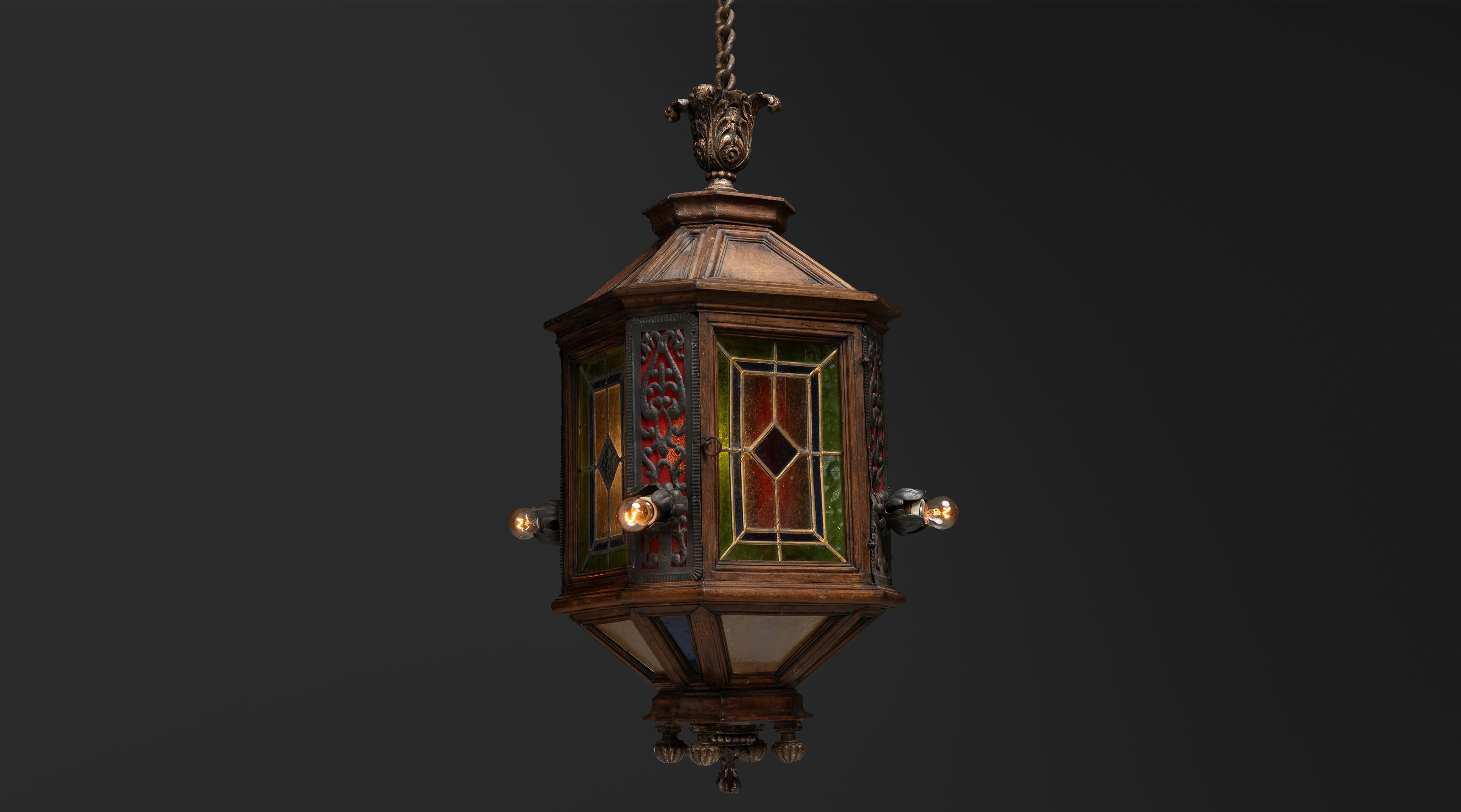 Stained Glass 
Wood Lantern

France, 1900

wood lantern with stained glass panels. Carved side details and exposed bulb arms. *Please note small crack in one green glass pane as shown in detail photographs*

19”dia x 42”h

Ref. L5316