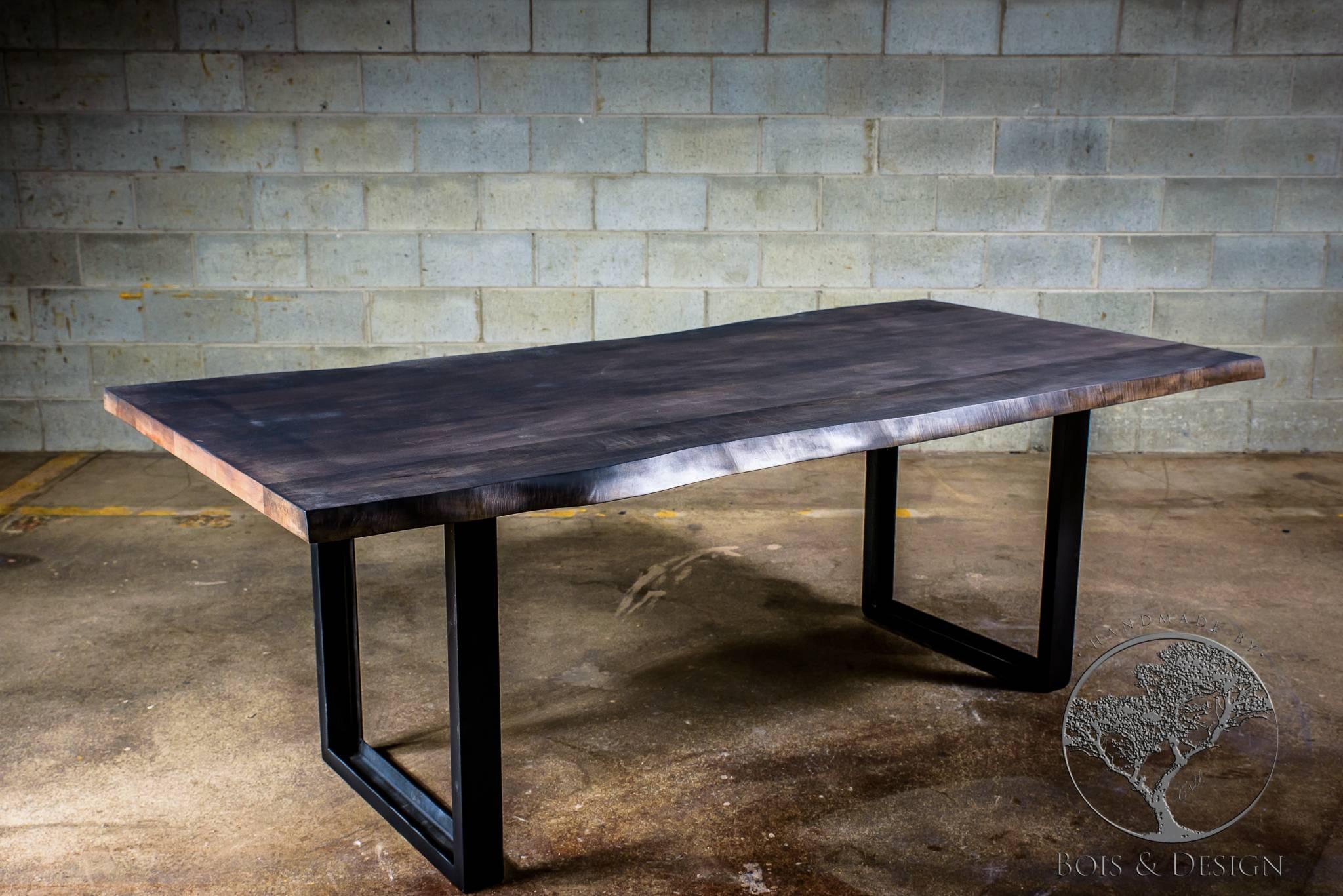 Maple is as Canadian as it gets. Also, it is a very flexible wood because of it's color. This particular dining table has been stained grey. We offer any color match stain. We make the sample and send it to you for approval. The legs are a U shape
