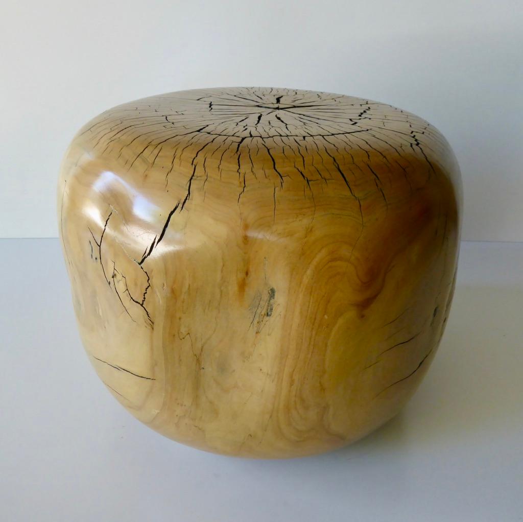 A stained solid cottonwood table/taboret by contemporary American artist Daniel Pollock. Dan hand-selected this sculptural piece of reclaimed cottonwood that has been dried and carved, leaving natural fissures that create an organic pattern. As with