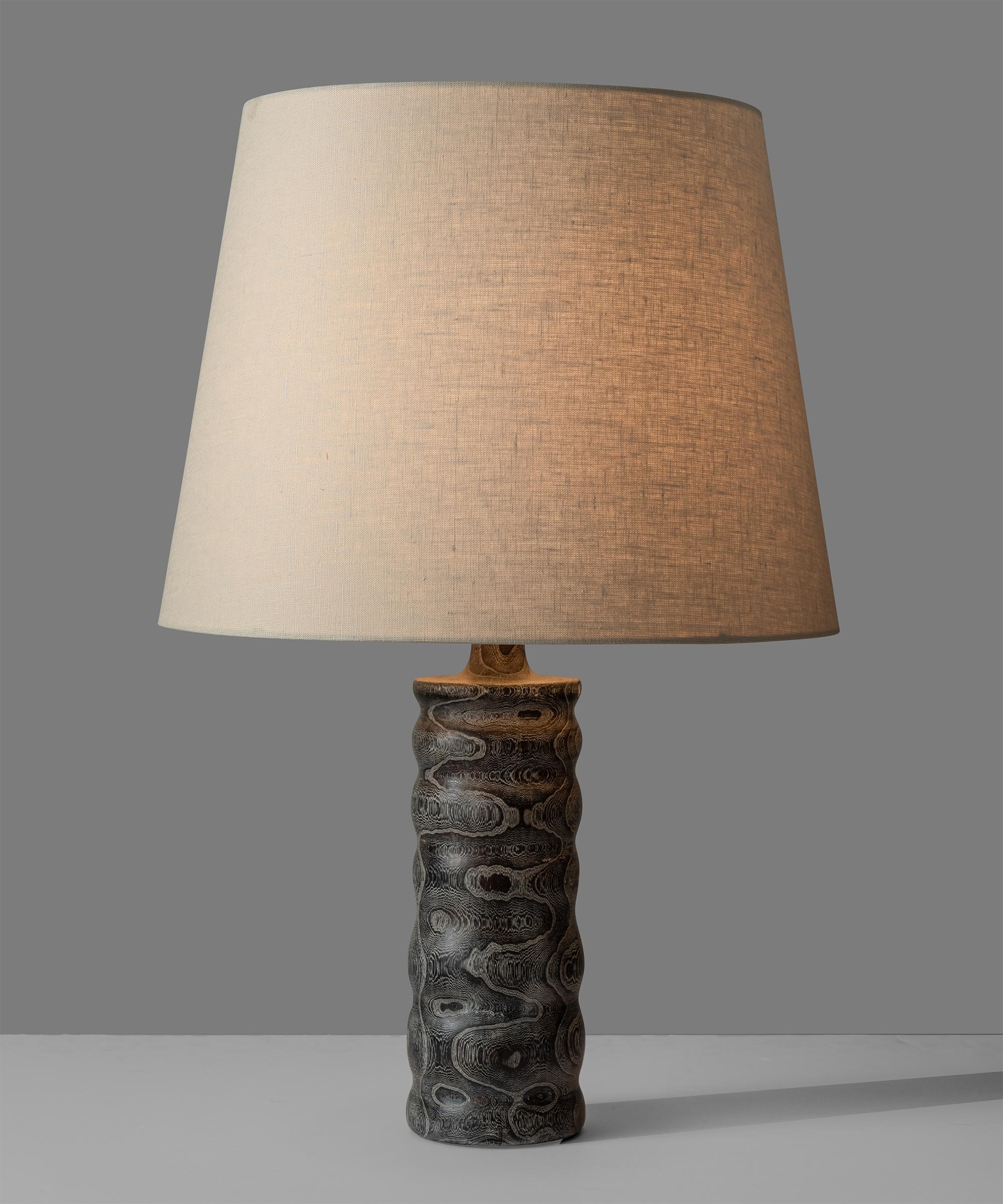 Stained wood table lamp, Sweden, circa 1960

Carved wooden base with intricate wood grain. New linen shade.

