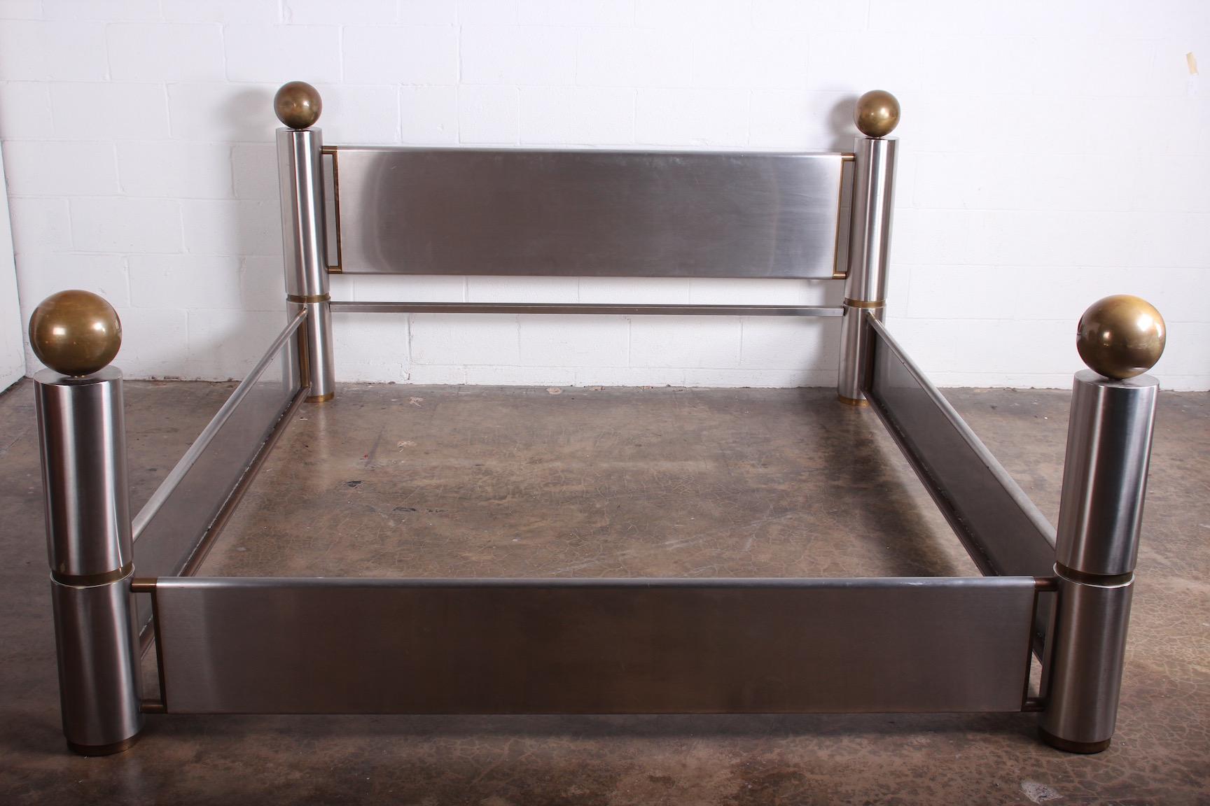 A finally crafted stainless steel and patinated brass California king size bed, 1980's.
Interior measurements: 72