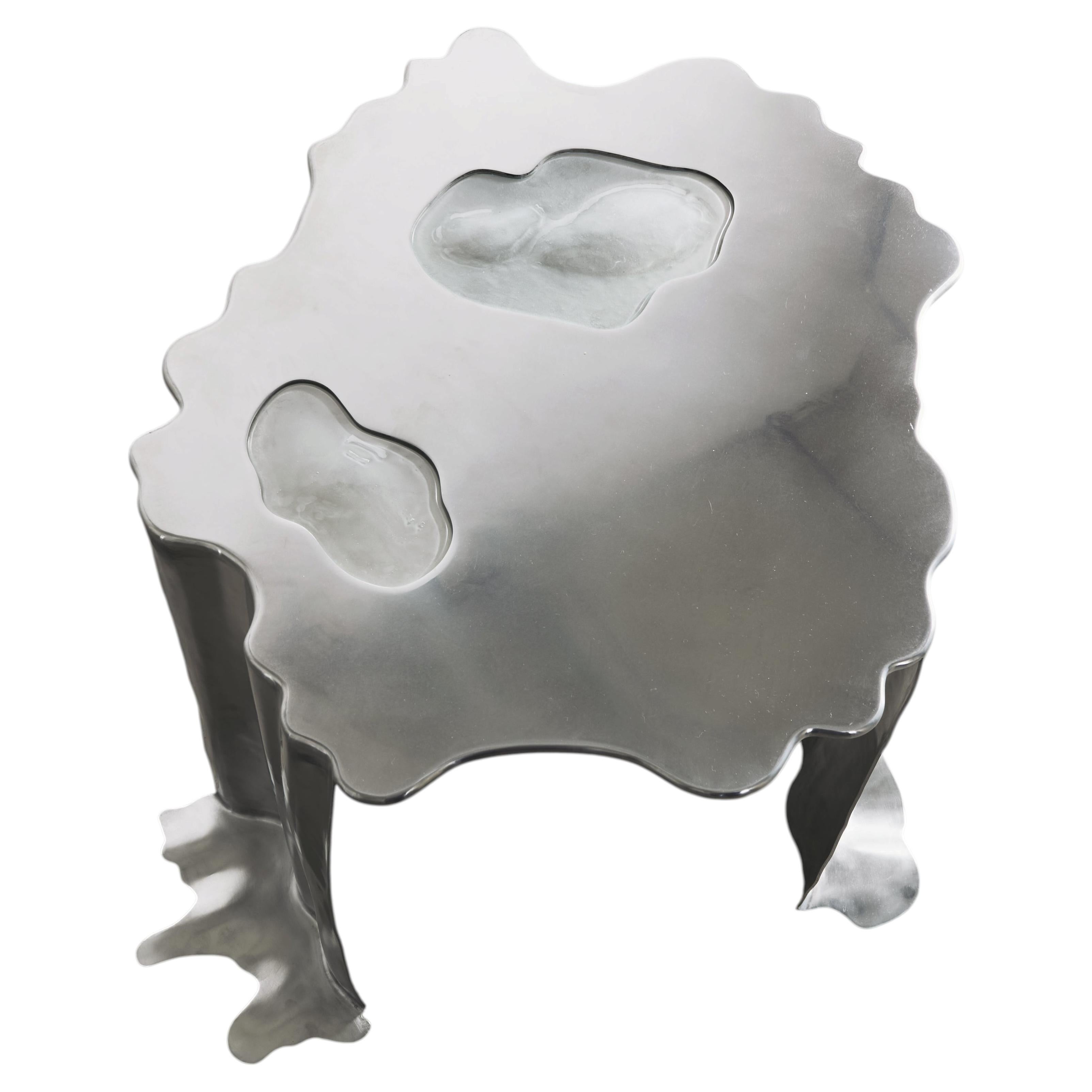 Table basse en acier inoxydable et verre, au design sculptural