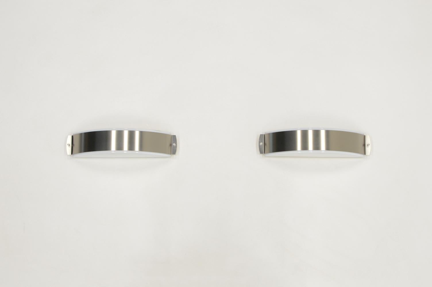 Mid-Century Modern Stainless steel and glass wall lamps made by Glashütte Limburg, 1970s Germany. For Sale