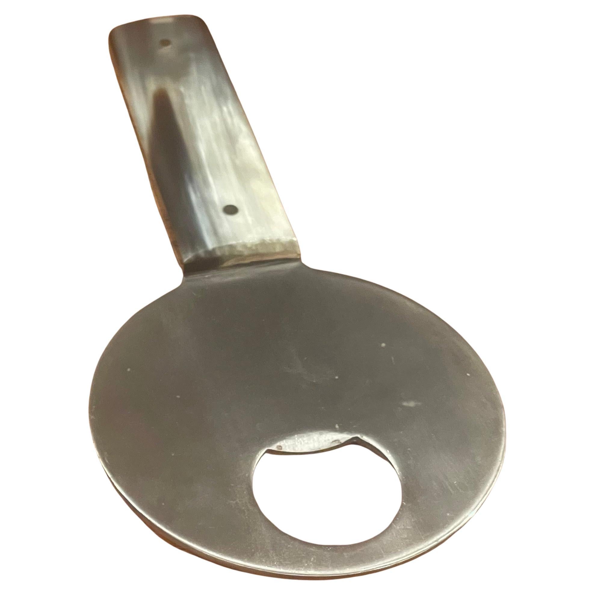 Beautiful vintage stainless steel and horn bottle opener by Carl Auböck, circa 1950s. The piece was hand-crafted in Austria, is in great vintage condition and measures 3