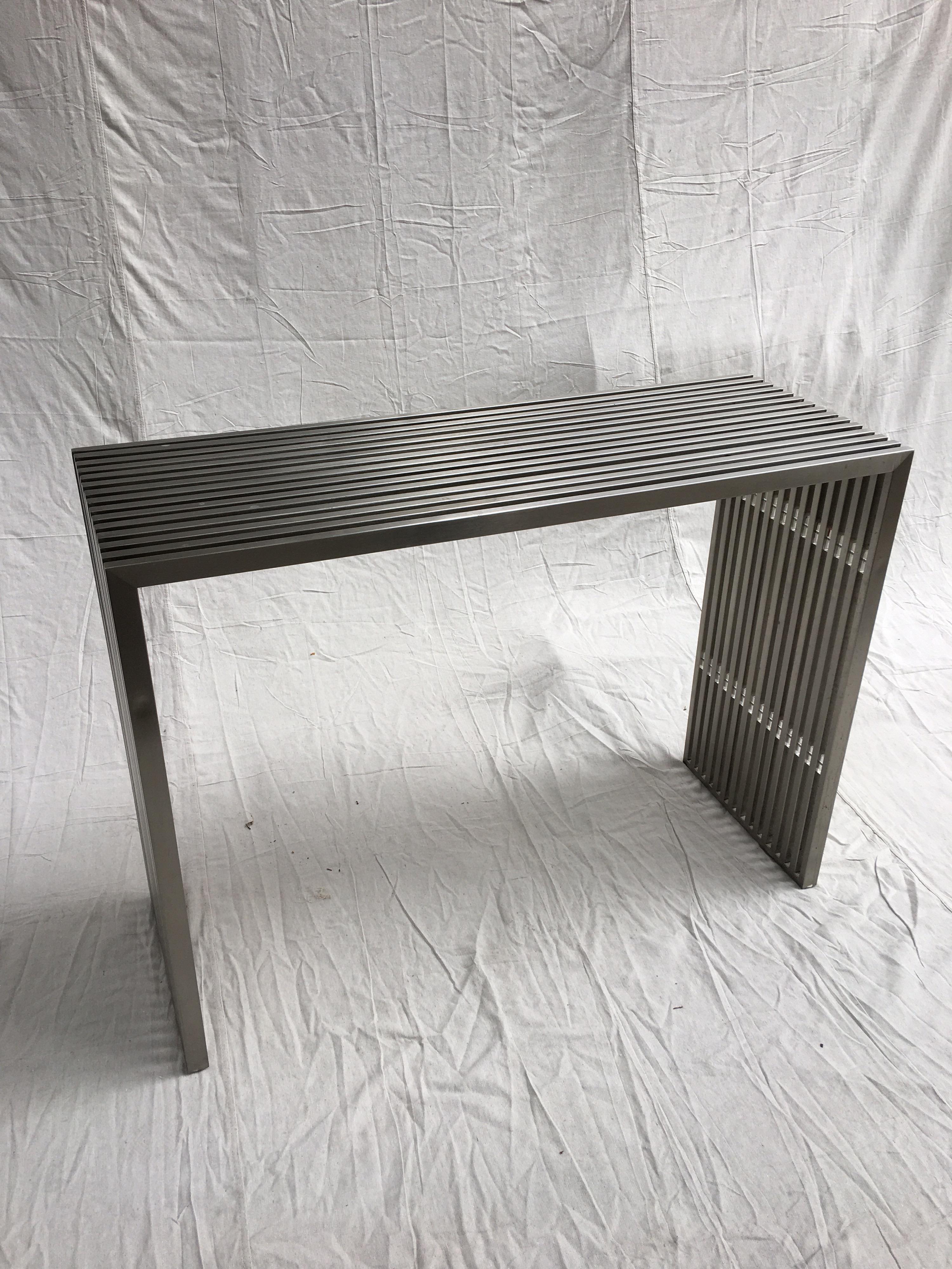 Stainless steel and Lucite slat console. Unique design, Lucite spacers add stability to this simple and elegant design. Nice welded corners to the stainless steel!