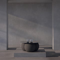 Stainless steel and round volcanic stone coffee table