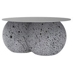 Stainless steel and round volcanic stone coffee table
