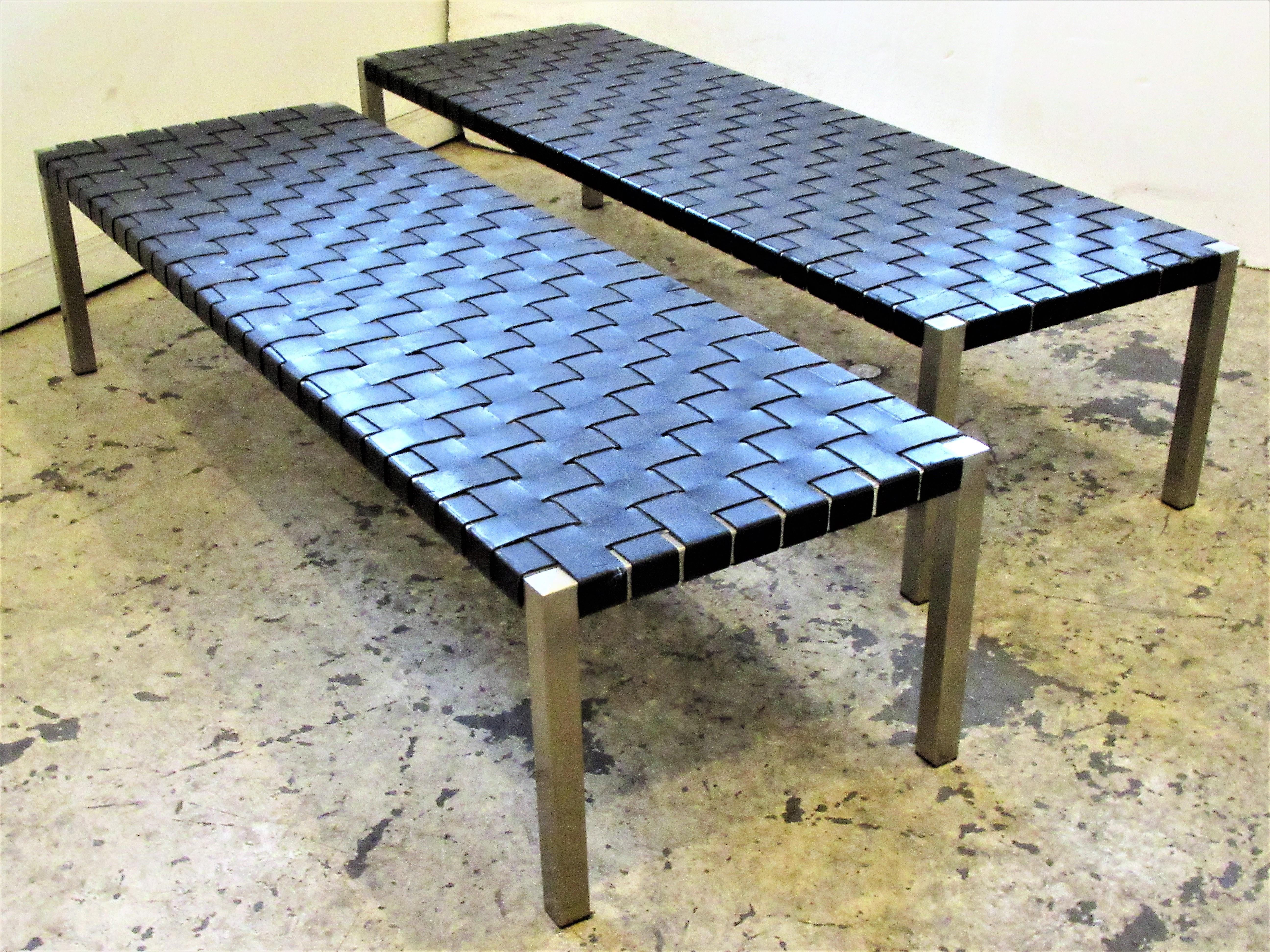 A beautiful matching pair of stainless steel frame classic long benches with black woven saddle leather seats by Ralph Lauren, circa 1980. Great original vintage condition. Look at all pictures and read condition report in comment section section.