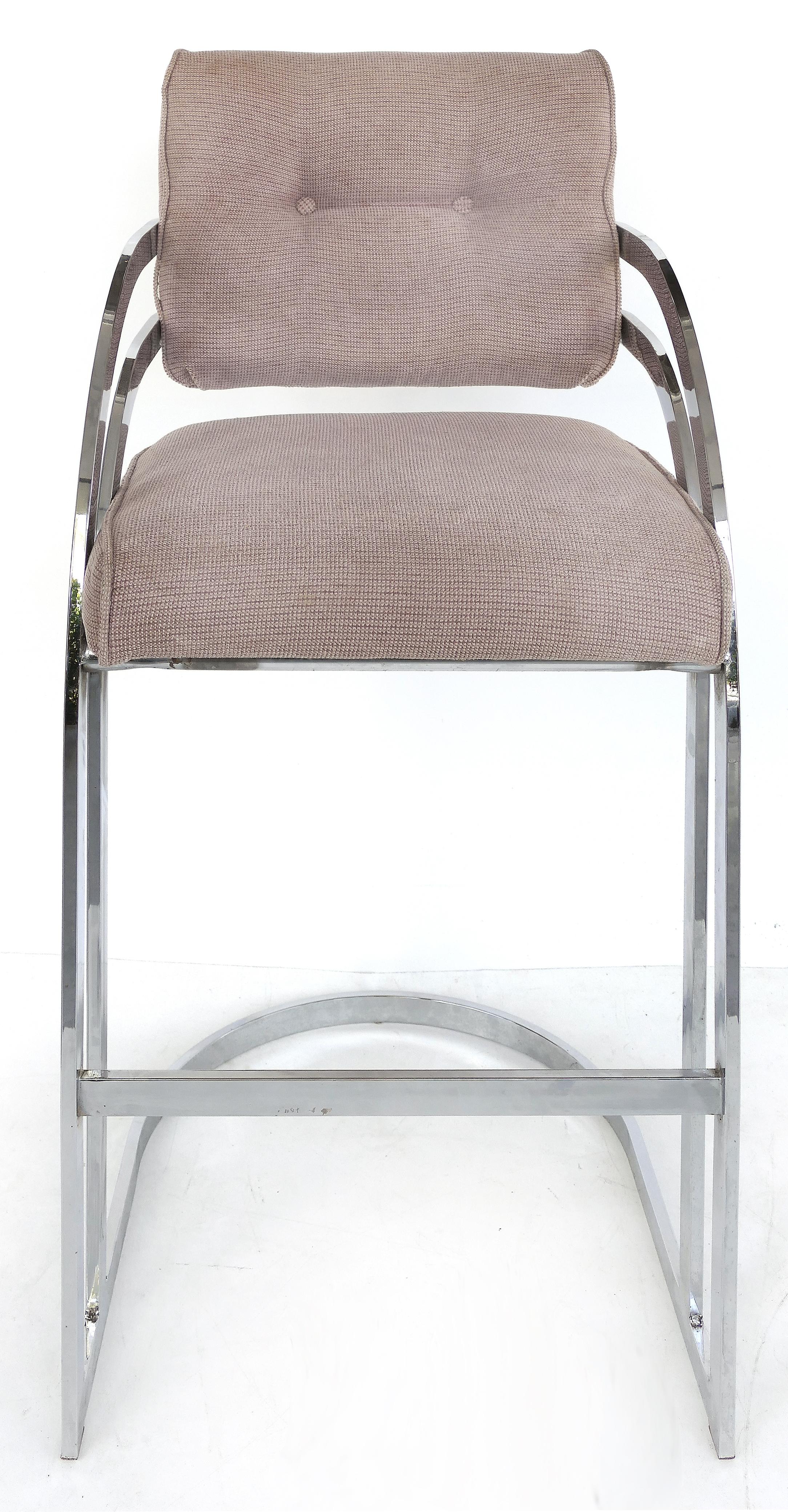 Stainless steel bar stools for DIA (Design Institute of America), pair

Offered for sale is a pair of polished stainless steel bar height stools with upholstered seats by the Design Institute of America. The stool frames are in great condition and
