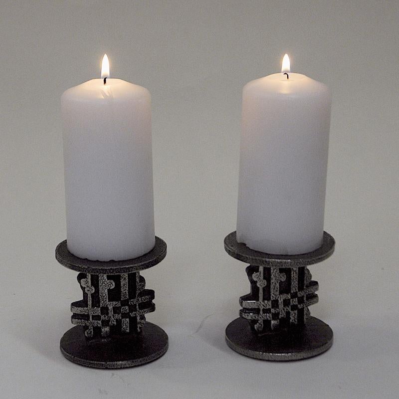 Beautiful and highly decorative brutalist pair of Stainless Steel candle holders for cube candles from the 