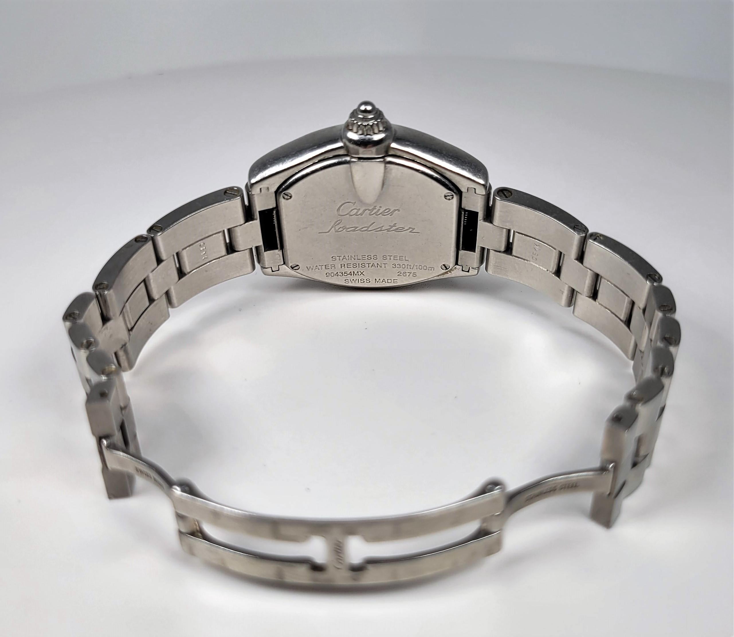 In stainless steel, this Cartier Roadster wrist watch is such a timeless design!

The wrist watch is accompanied by the original Cartier box, an extra leather strap and two additional stainless steel links.  The interior measurement of the bracelet