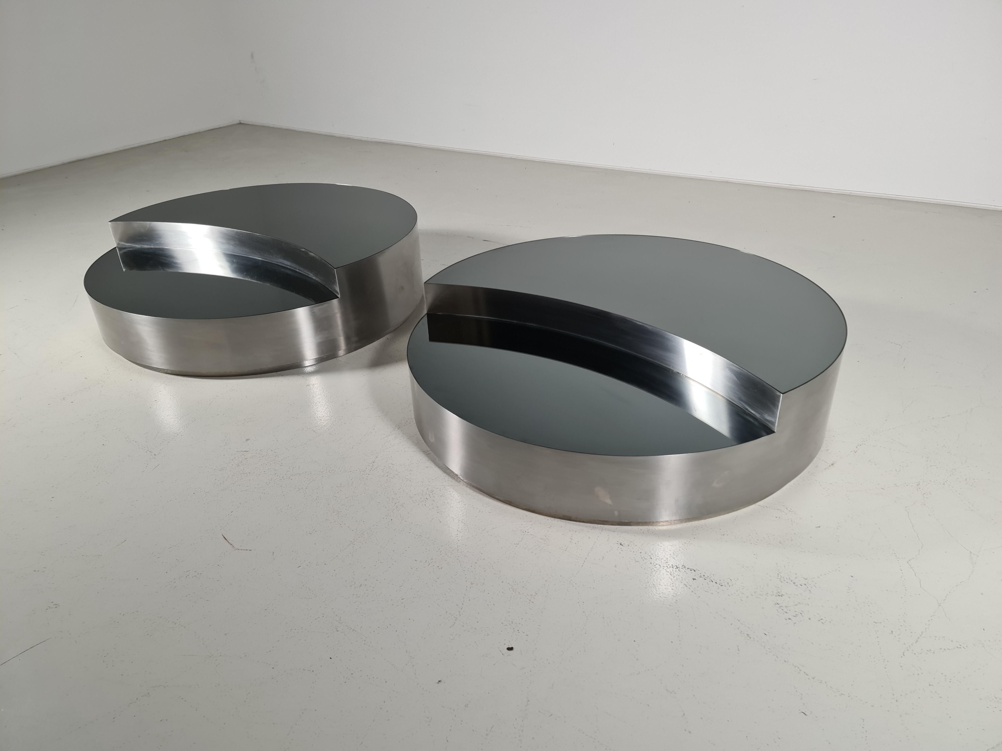 Coffee table in the style of the TRG revolving table made by Willy Rizzo and Massimo Papiri. Brushed stainless steel base and a smoked mirrored top. From the 1970s. We have 2 available.