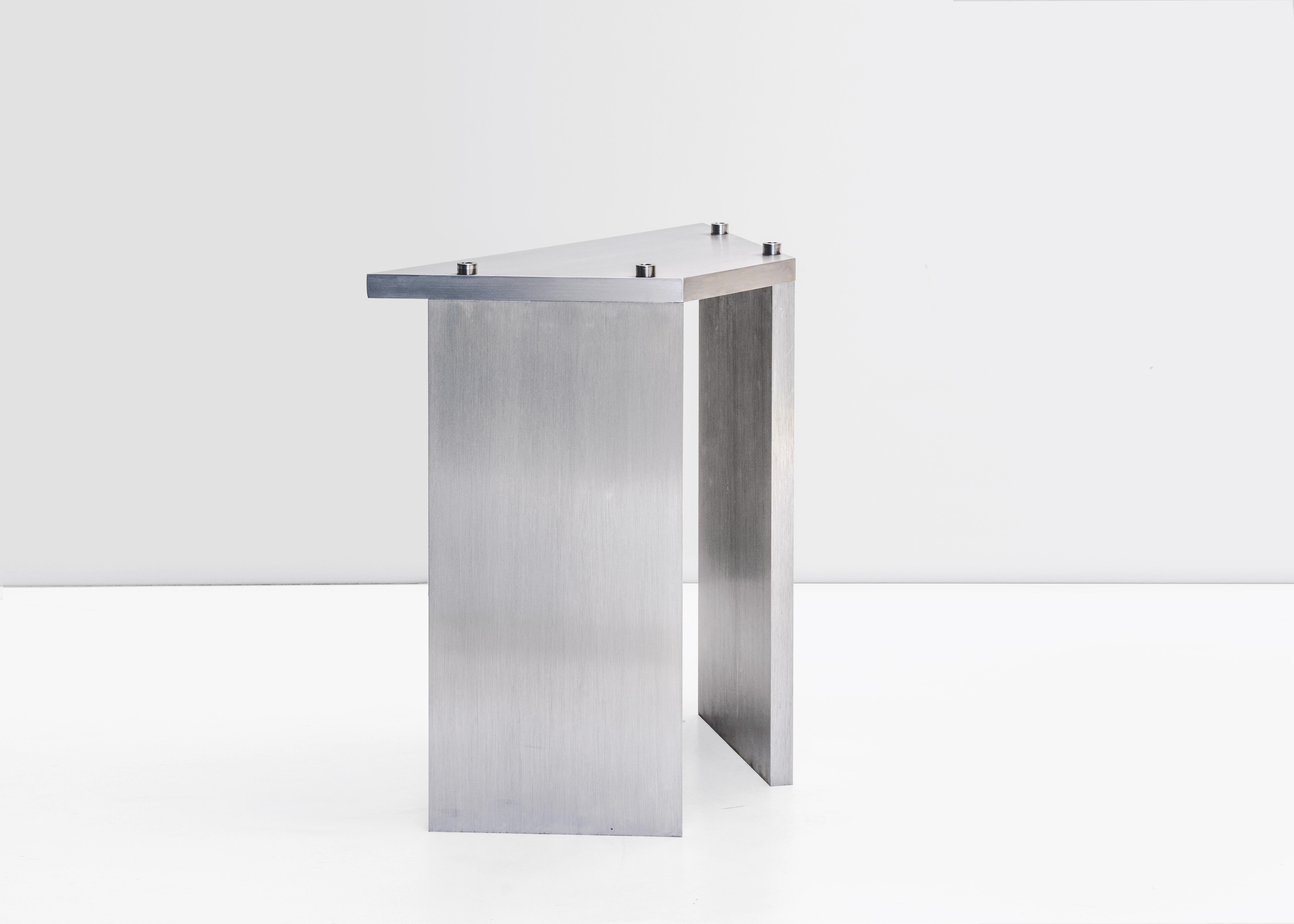 Contemporary stackable stool by Johan Viladrich
Stackable stool
Anodised aluminum,
Stainless steel bolts
Measures: L43 W20 H45 cm
Apprx. 15kg
Limited Edition of 200 + 20AP

The table is composed of two brushed aluminium plates leaning onto