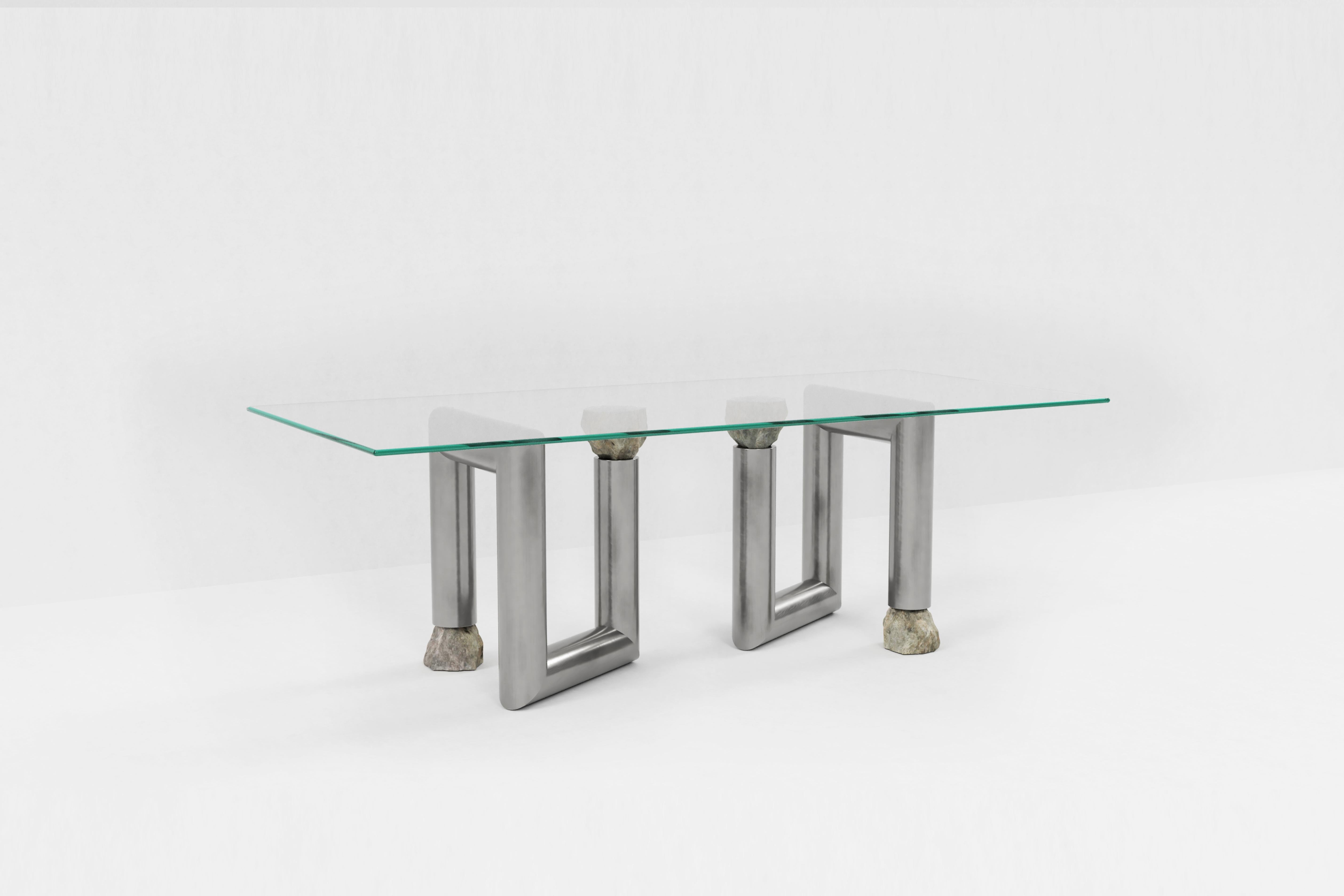 Stainless steel dining table by Batten and Kamp
Limited edition of 24 + 3 AP.
Dimensions: D 250 x W 115 x H 73 cm 
Materials: Hand brushed stainless steel, toughed glass, granite stone

The top can be made to the buyer's preference.

Batten and Kamp