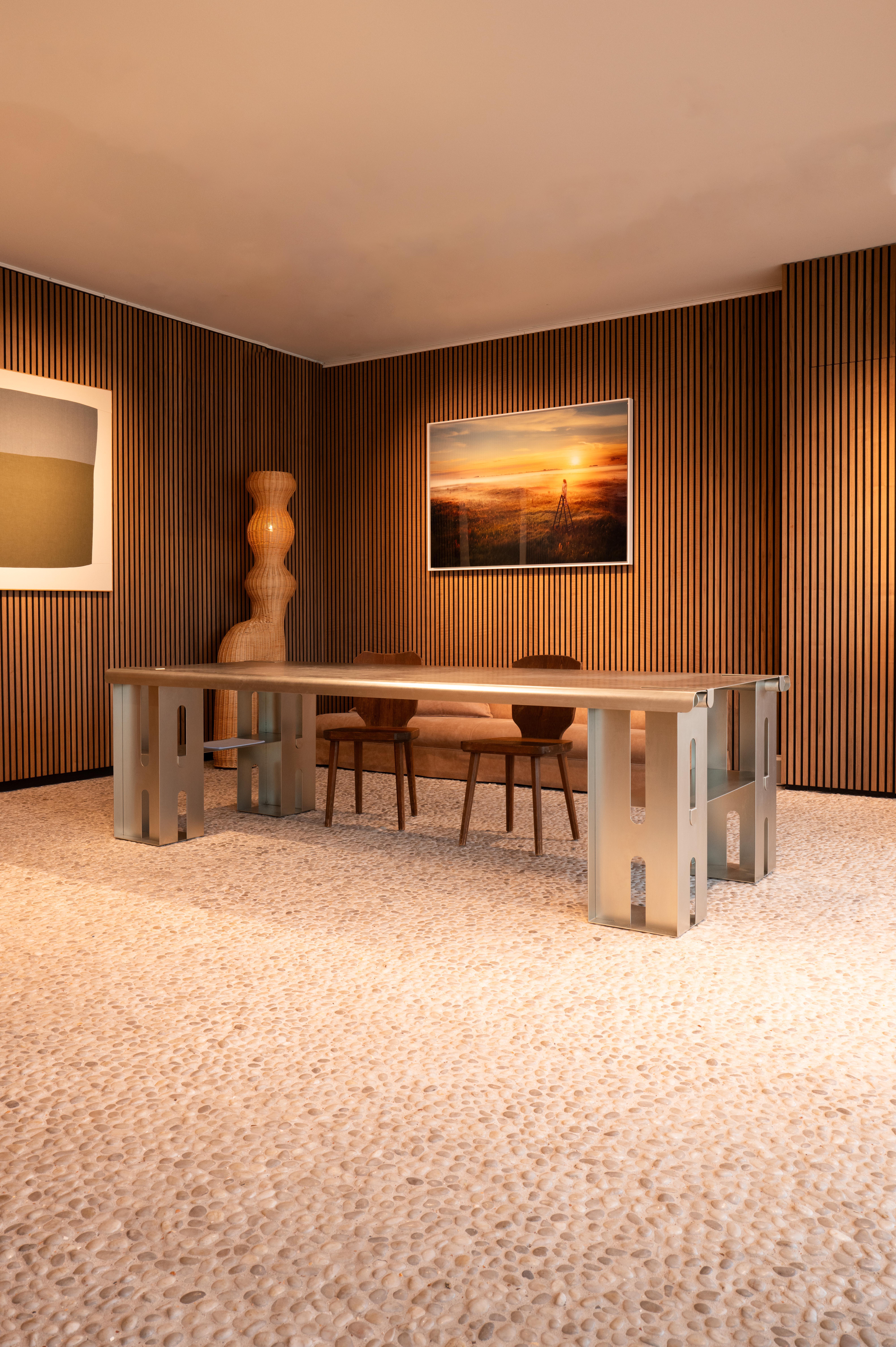The SZ_02 dining table by Belgian designer Rebecca Ackaert is a bold investigation of scale, proportion, and spatial rhythm. Known for her architectural approach and refined material choices, Ackaert creates pieces that blur the line between object