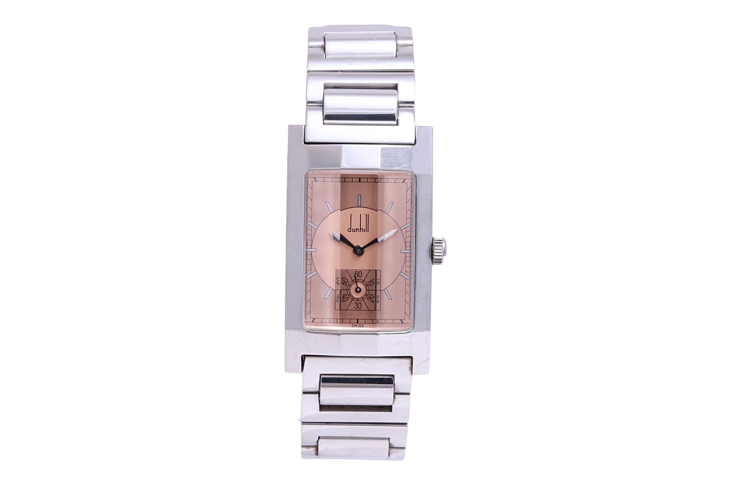 Stainless Steel Dunhill Facet Art Deco Style Wrist Watch with Box & Papers in beautiful Condition

Has a magnificent facetted glass like case !

Case & Strap : Stainless Steel ,Waterproof 30M, Will fit a 19 cm Wrist

Movement : Quartz

Dial : Salmon