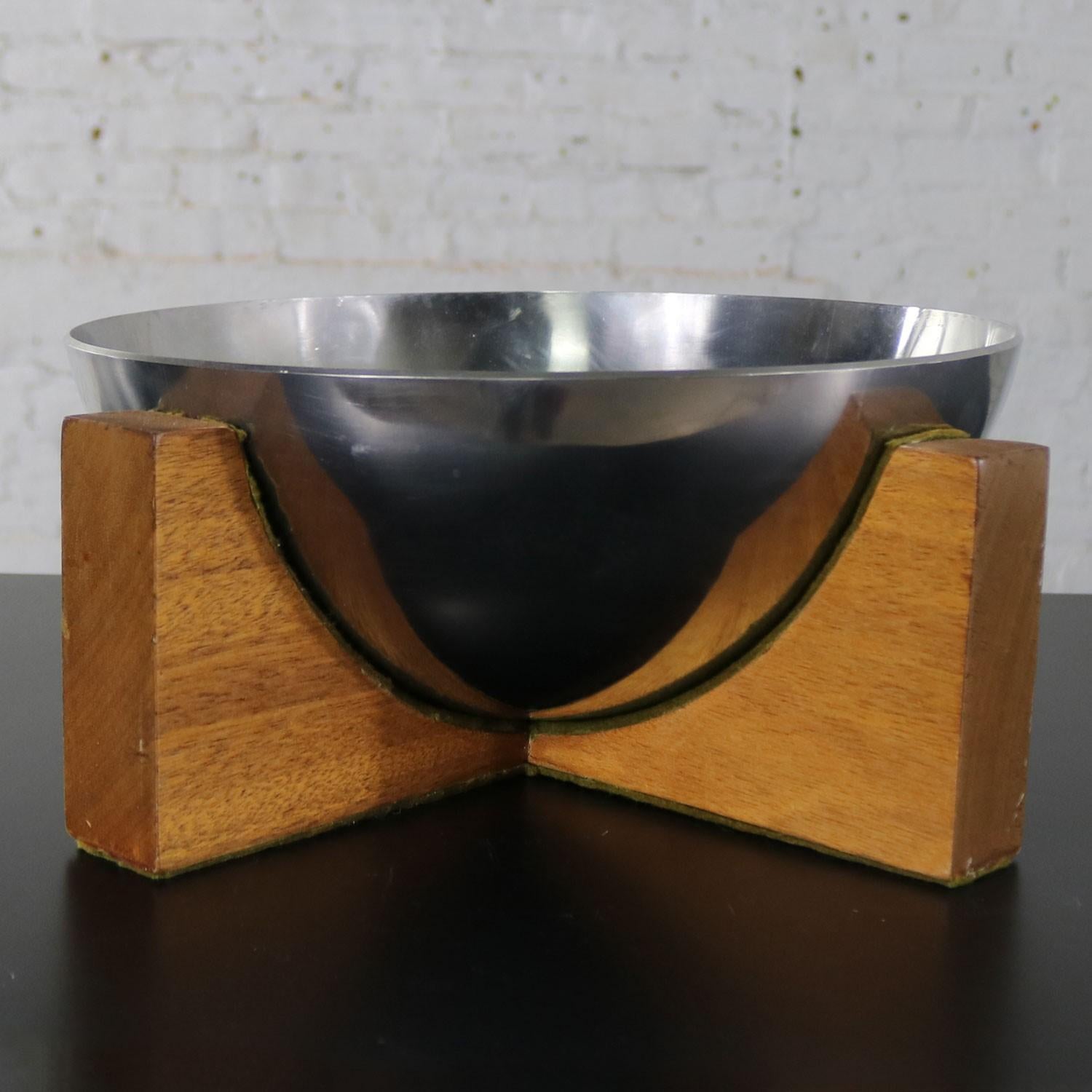 Handsome centerpiece Mid-Century Modern stainless-steel half sphere bowl on a mahogany wood plus sign or cross stand. This piece seems to be artist made but is unsigned. It is in wonderful vintage condition but not without signs of its age. Please