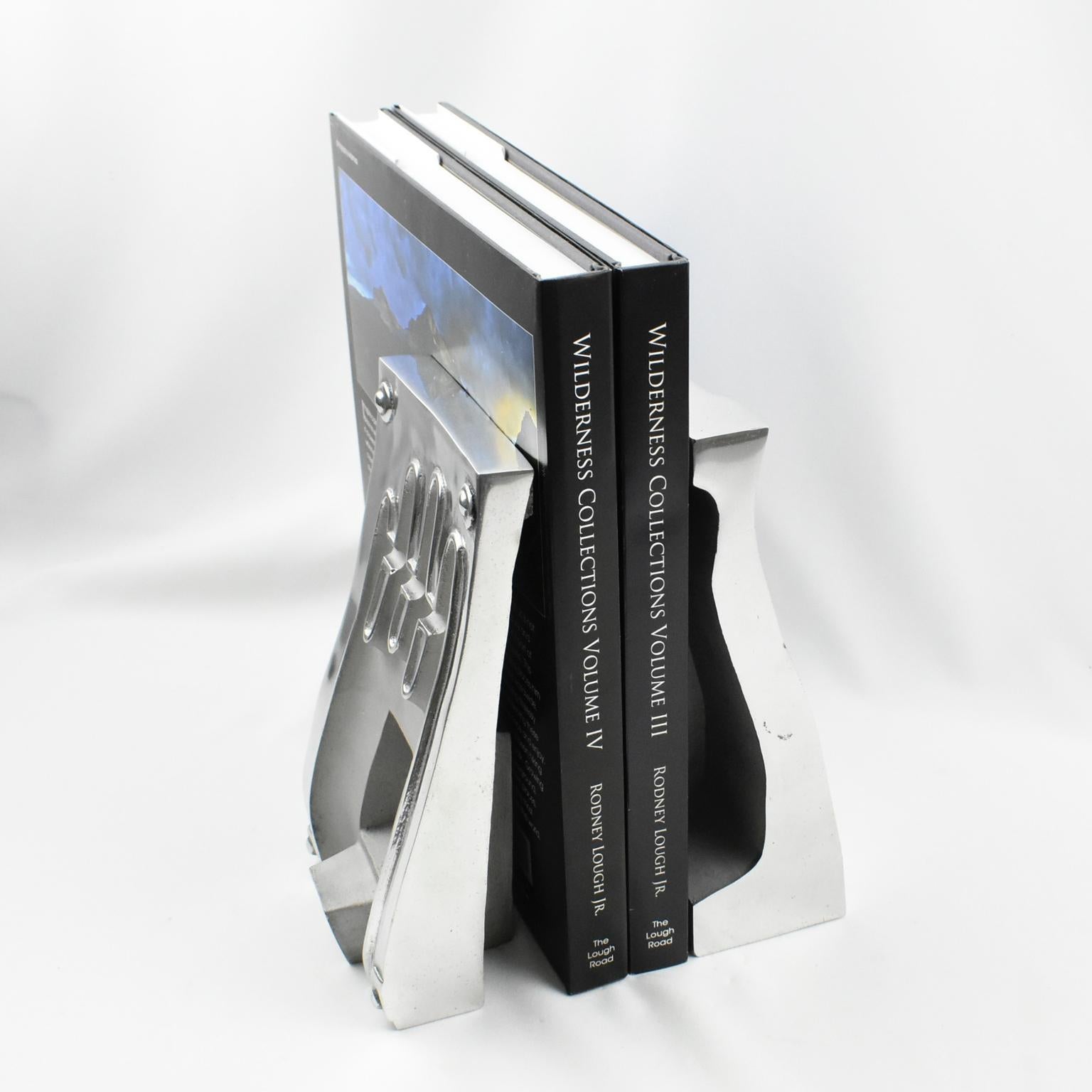 This stunning pair of industrial stainless steel hand or glove molds has their use turned into bookends. Those forms are the female and male parts of a complete mold. They look spectacular as sculptures or bookends on an étagère or a console. The