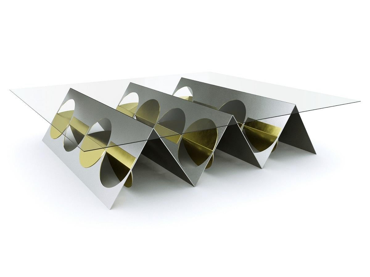 Stainless steel inverted pyramid coffee table by Ana Volante Studio
The Moon Collection
Dimensions: L 160 x W 50 x H 42 cm
Materials: Stainless steel, brass, glass on top

Ana Volante, founder of Ana Volante Studio, is a Venezuelan designer