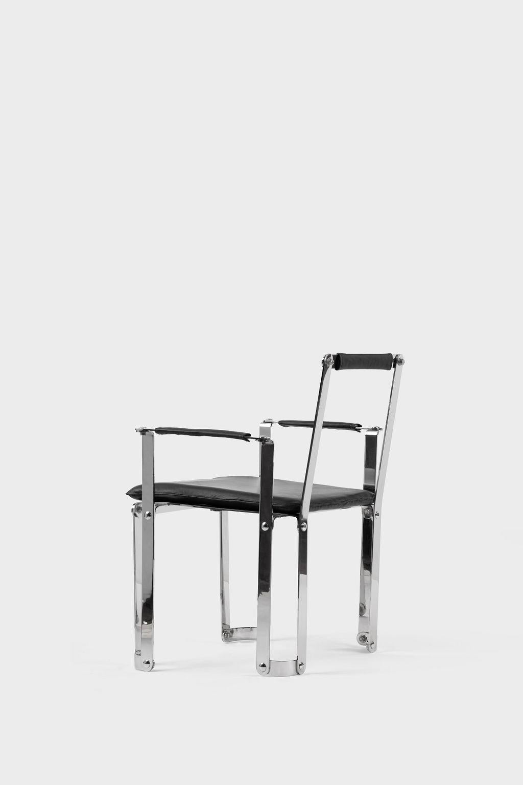 One-of-a-kind Bauhaus inspired loung chair made out from 21 pieces of stainless steel and 4 apliquees in black leather. Regarding the Bauhaus principles, the chair can be disassembled and easily moved. 1600