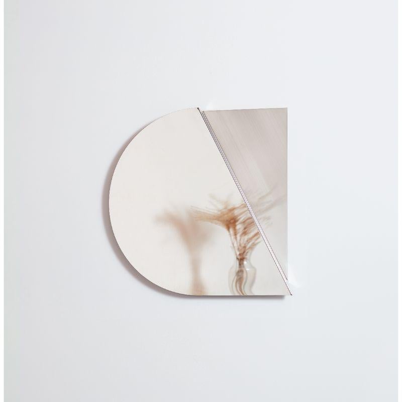 Stainless steel mirror, silver semicircle by Theodora Alfredsdottir
Materials: Mirror
Dimensions: 50 x 50 cm

Also available: circle, Rectangular in different colors (silver, black onyx and champagne),

The collection consist of three types of