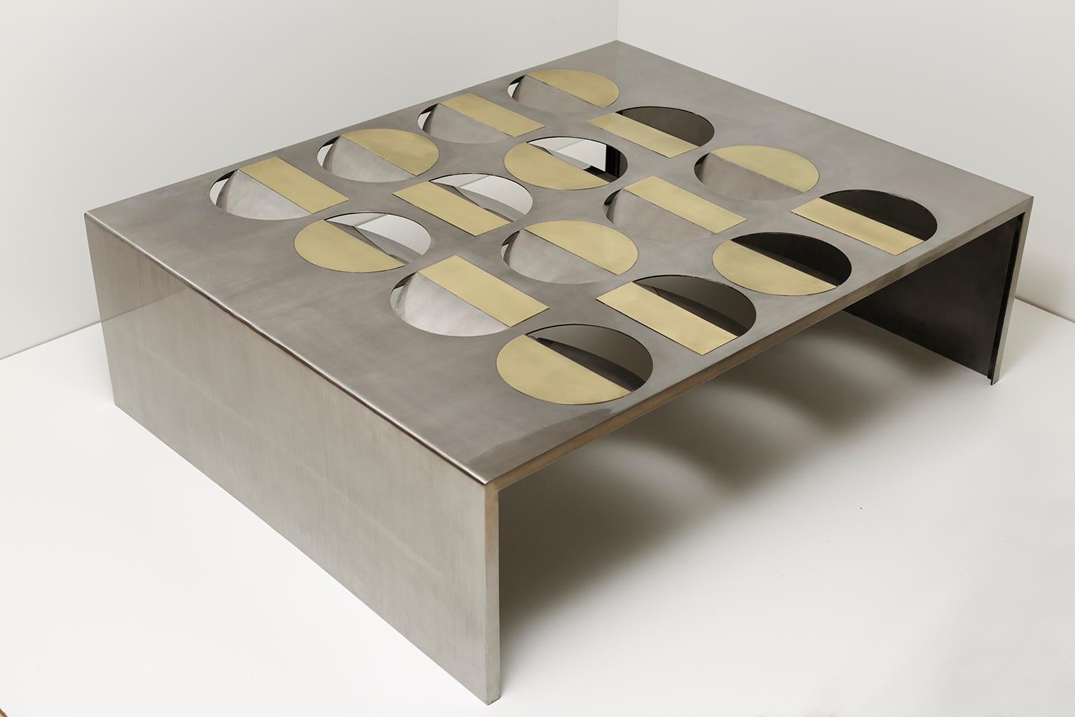 Stainless steel moonland coffee table by Ana Volante Studio
The Moon Collection
Dimensions: L 150 x W 120 x H 45 cm
Materials: Stainless steel, brass, glass on top

Ana Volante, founder of Ana Volante Studio, is a Venezuelan designer