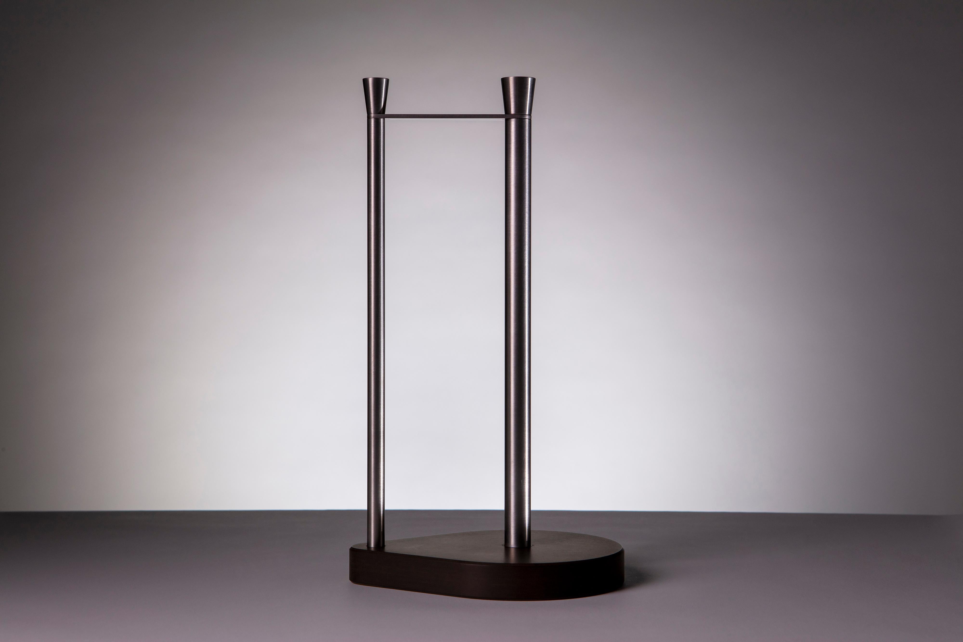 Elegant modernist stainless steel paper towel holder with an off-black Paperstone base - unique and functional.
