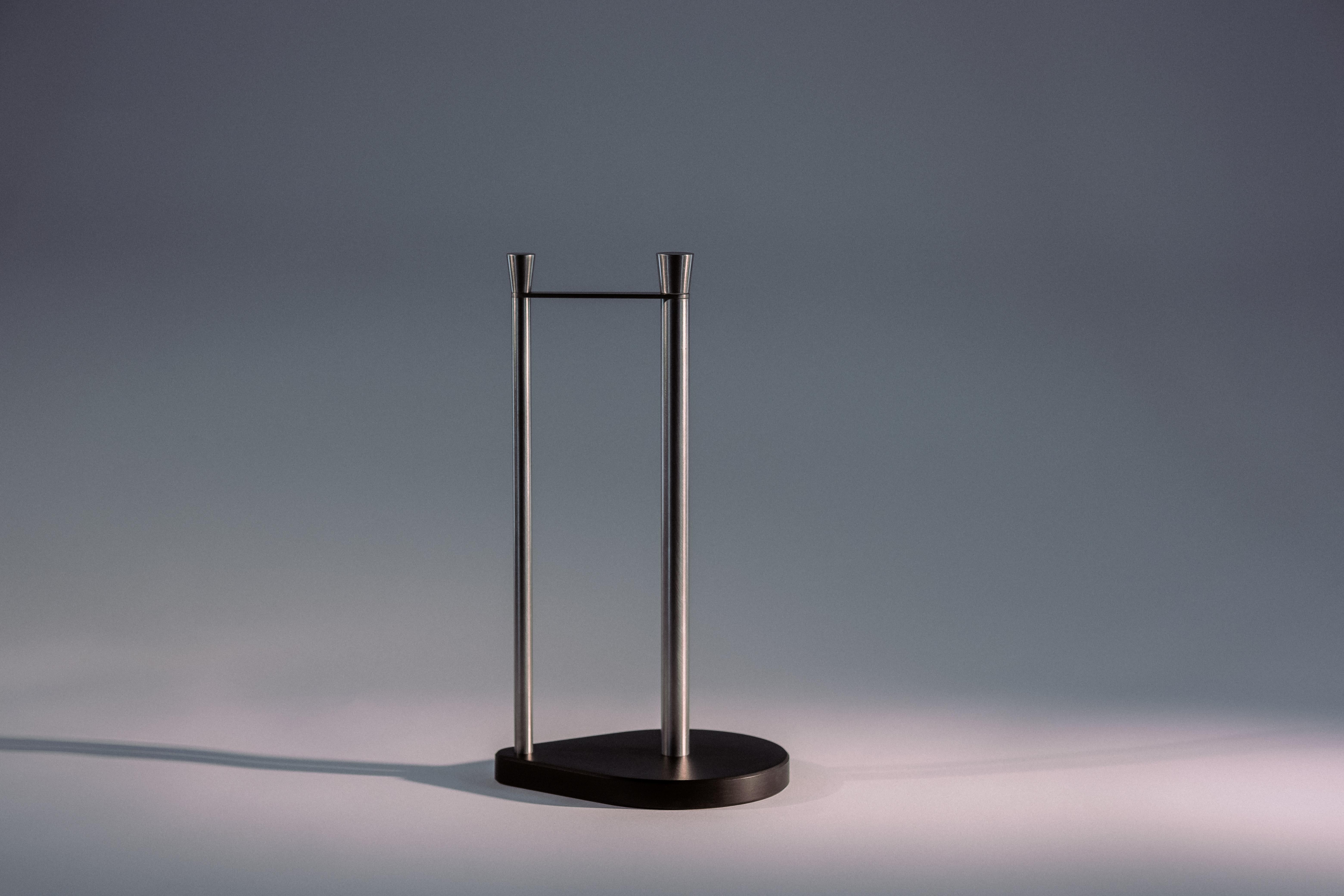 Elegant modernist stainless steel paper towel holder with an off-black Paperstone base - unique and functional.
