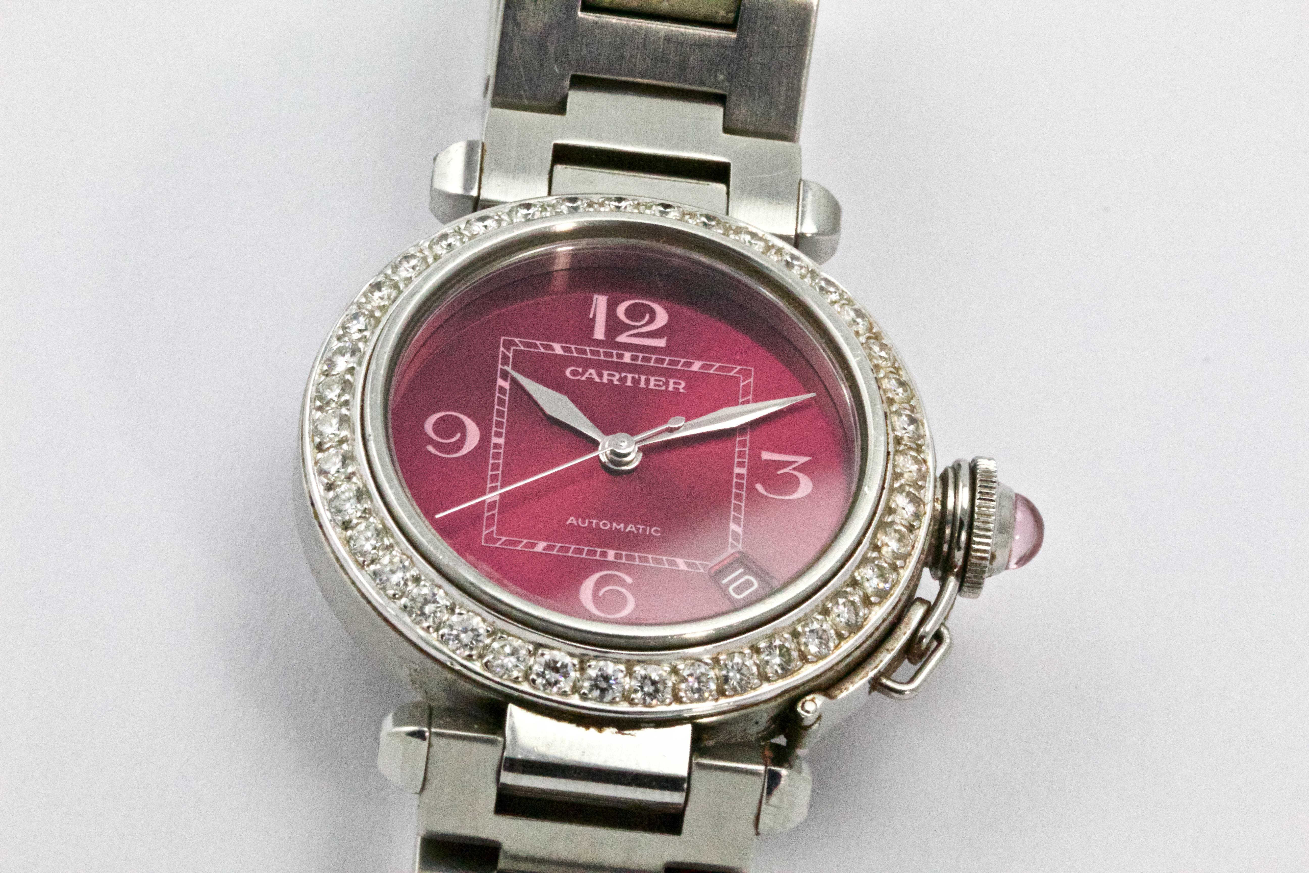 A fine quality Pasha de Cartier ladies Wrist Watch, stainless steel water resistant case with  Diamond Bezel, 38 Round Brilliant cut Diamonds totalling 1.52 carats. Complete with an automatic, self winding movement, a bright pearlescent pink/purple