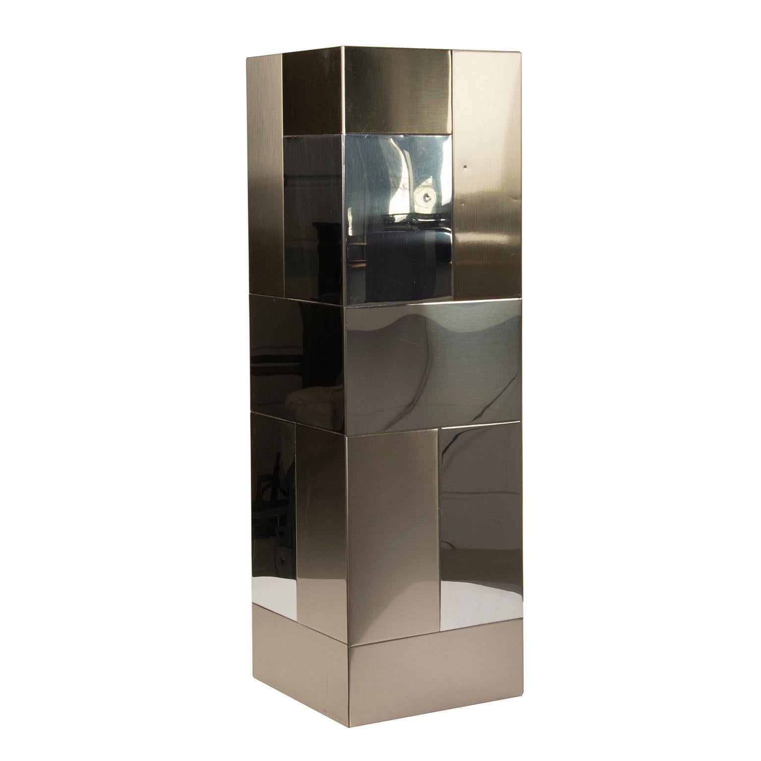 This 10”x10”x32” bench made wood pedestal is clad in bright and brushed stainless steel sections and is typical of Paul Evan’s “Cityscape” designs of the 1970’s.
It is highly decorative and functional and is great for displaying sculpture or as a