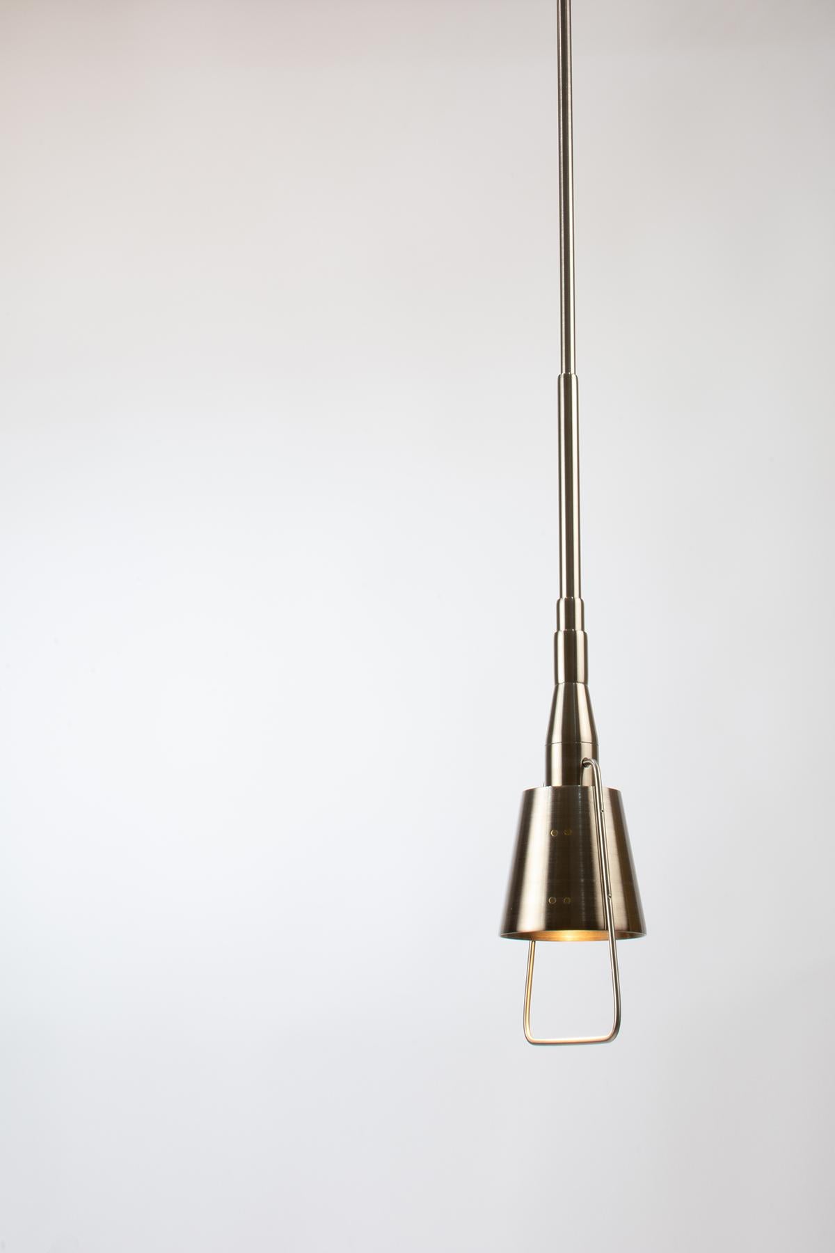 The exquisite pendant lamp, expertly crafted from high-quality stainless steel materials including pipes, rods, and reducers, 2 mm thick.

Designed to create a cozy light spot just above your coffee table, this lamp boasts a unique feature. A