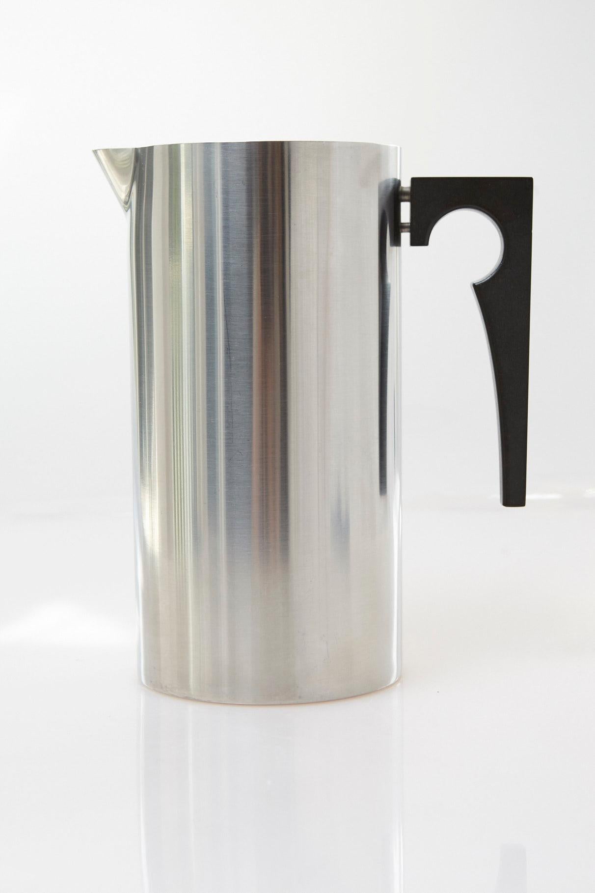 Original vintage piece, cool stainless steel (18/8/) pitcher with ice lip and wood handle,
from the cylinder line designed by Arne Jacobsen for Stelton, Denmark, circa 1980s.
Marked on the bottom.
The pitcher is in very good condition.
  
