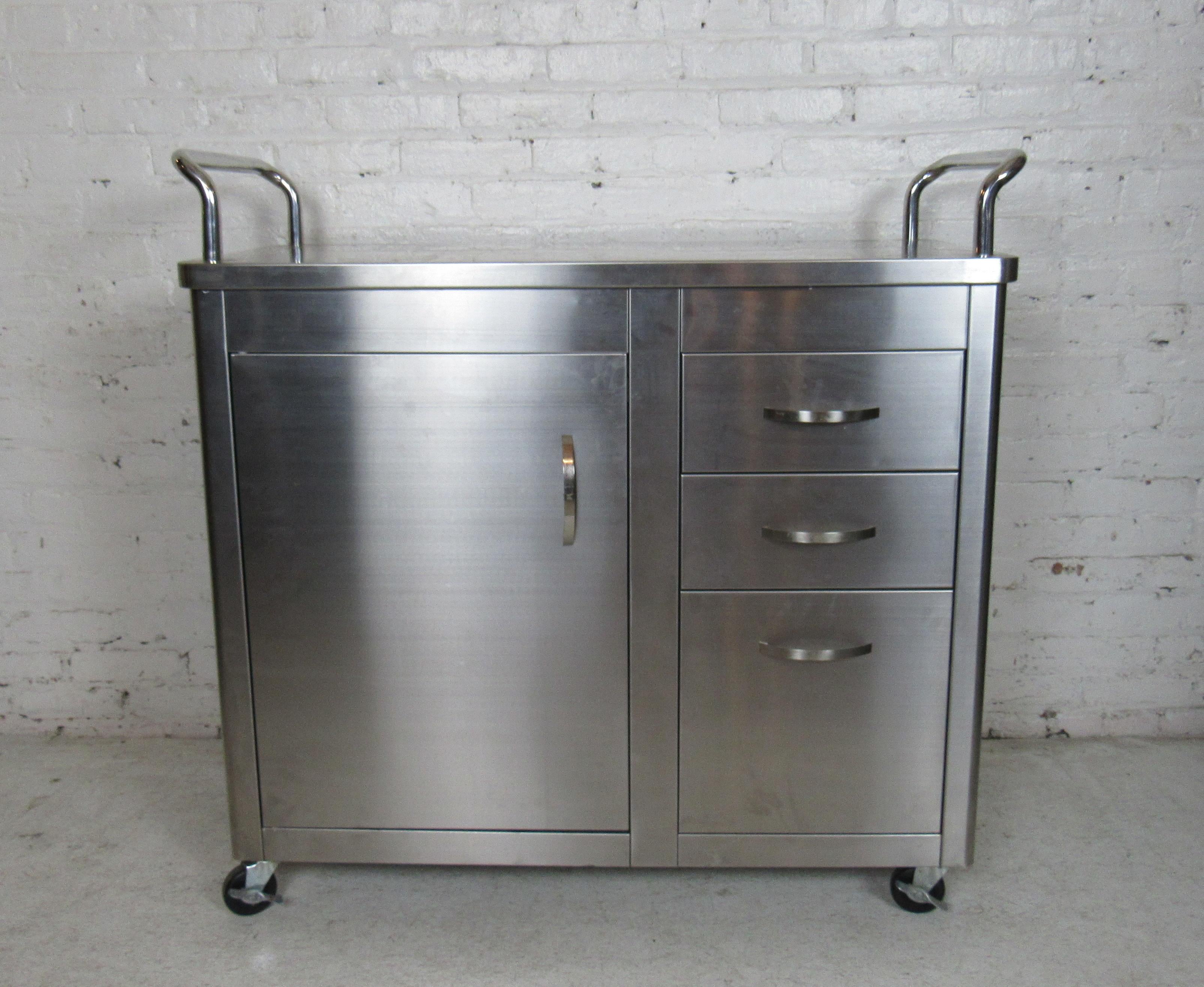 This clean stainless steel rolling cart can be used for storage or a kitchen island.
Featured on a set of wheels which makes this cart easy to maneuver.
(Please confirm item location - NY or NJ - with dealer).