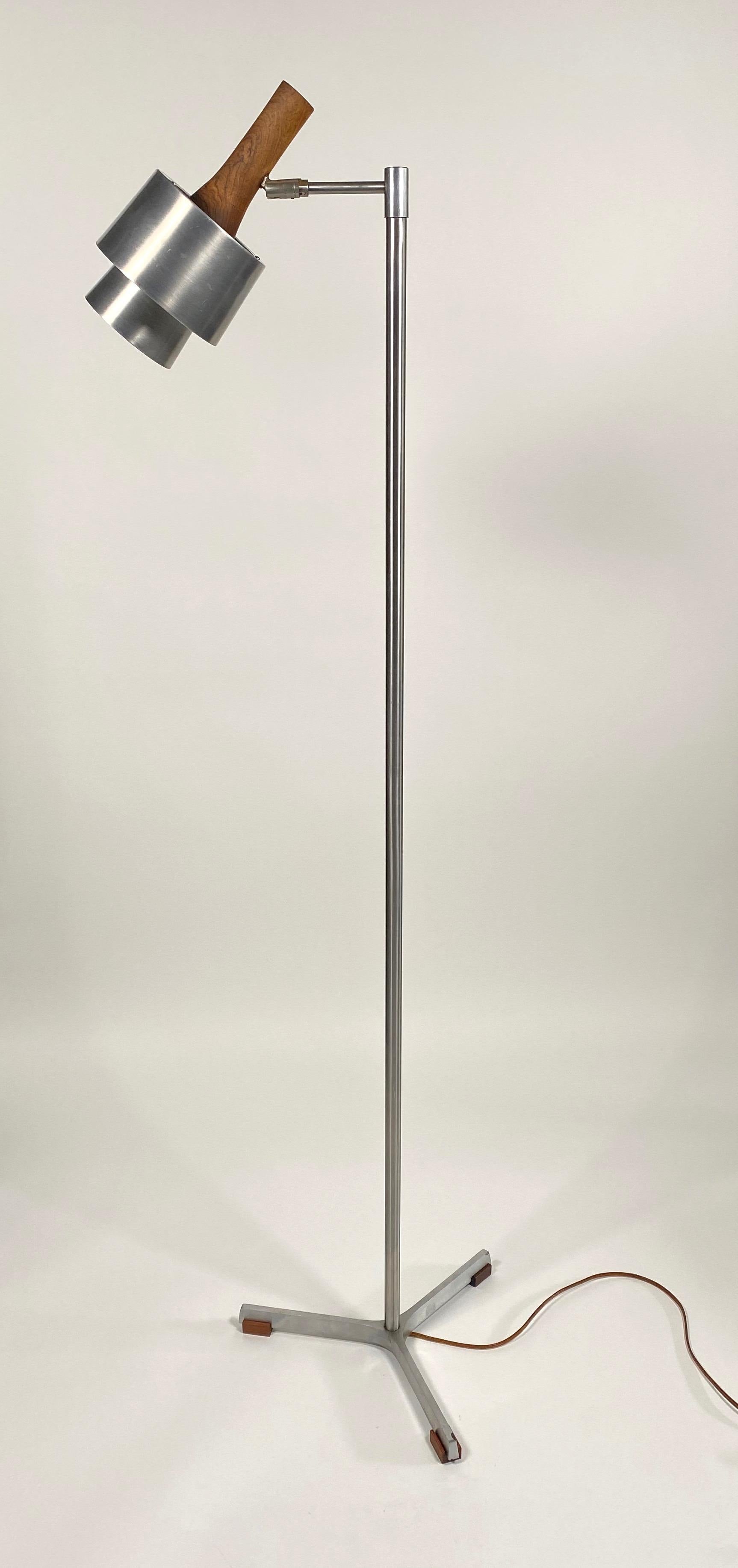 Floor lamp constructed of stainless steel, chromed steel, aluminum and rosewood. designed by Johannes (Jo) Hammerborg (1920-1982) an Industrial designer who attended the Academy of Applied Arts in Denmark and was the artistic director of Fog &